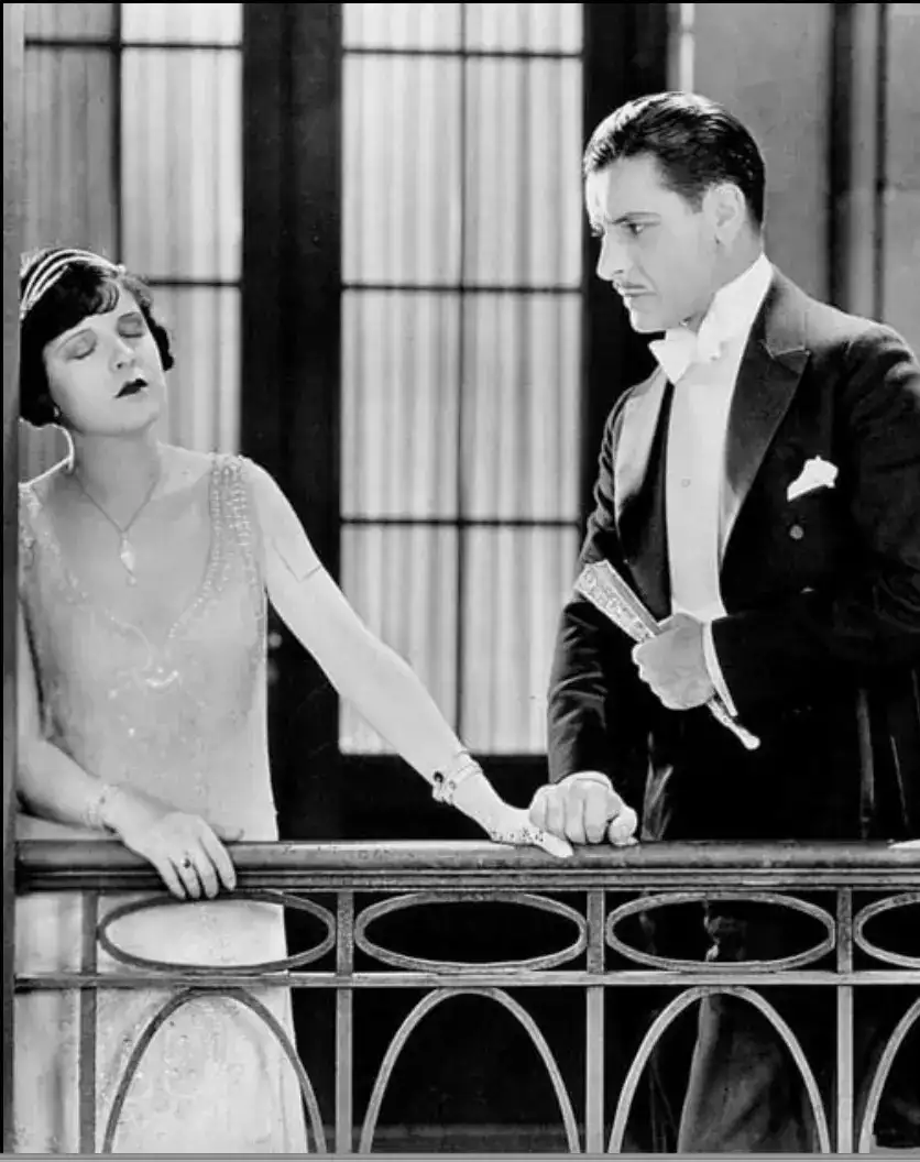 a man and woman in formal wear