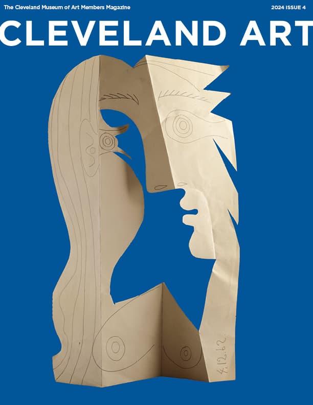 Cut up and folded paper face, blue backdrop