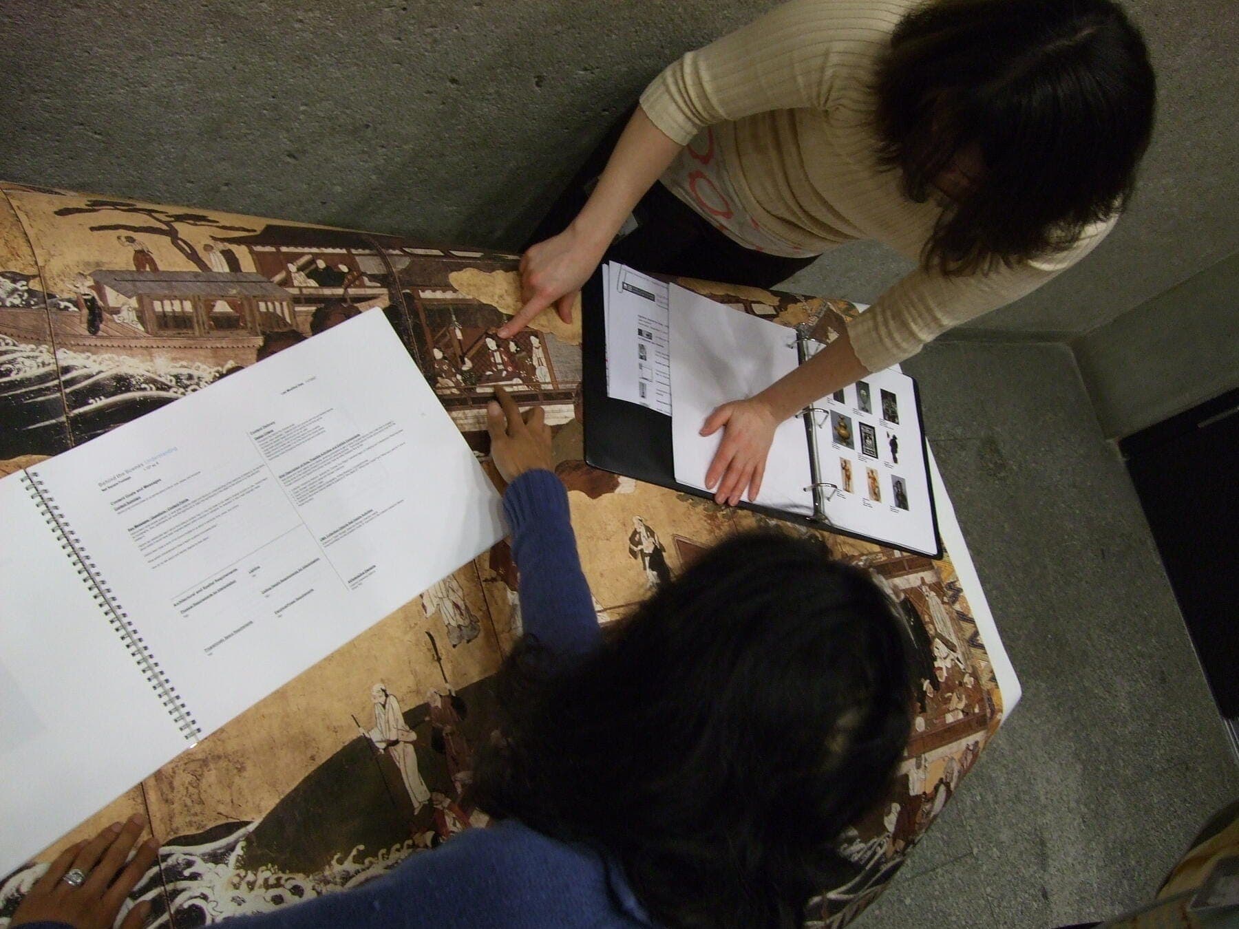 a few people looking at a map