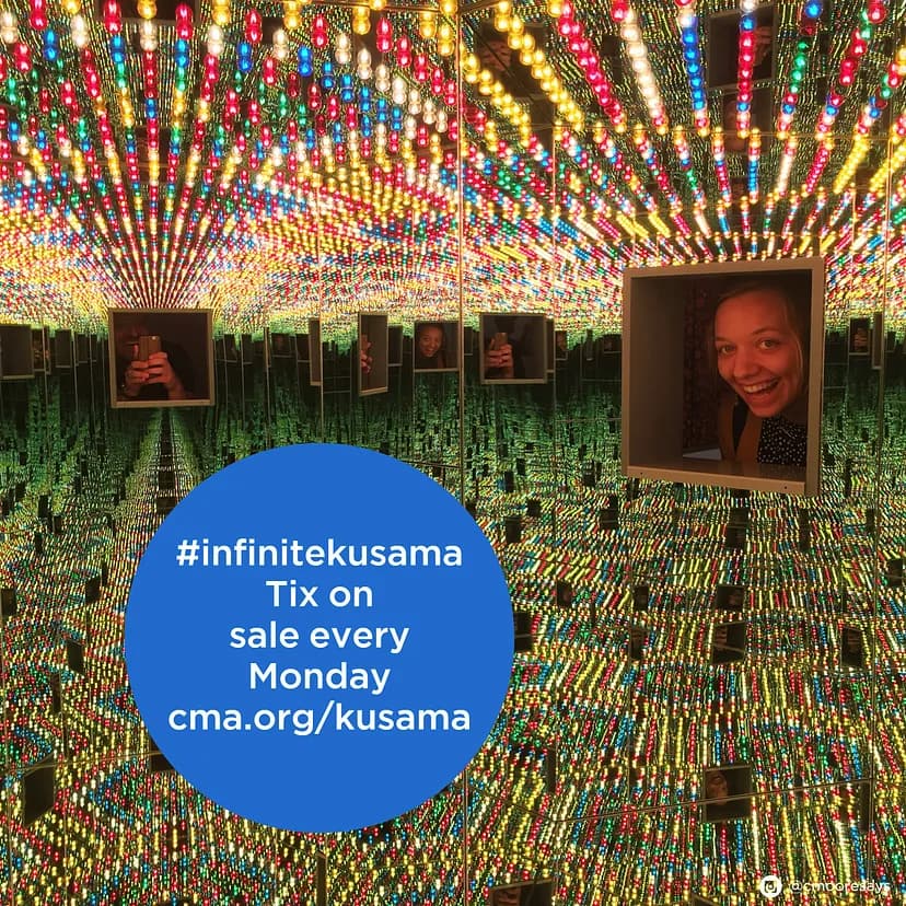 Exhibition image of room with rows of yellow, green, blue, and red lights reflected everywhere and a smiling person looking in from a window. "#infinitekusama Tix on sale every Monday cma.org/kusama"