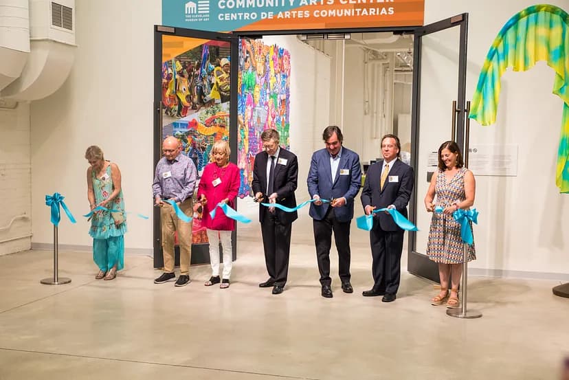 People cutting the ribbon at the opening of the Community Arts Center.