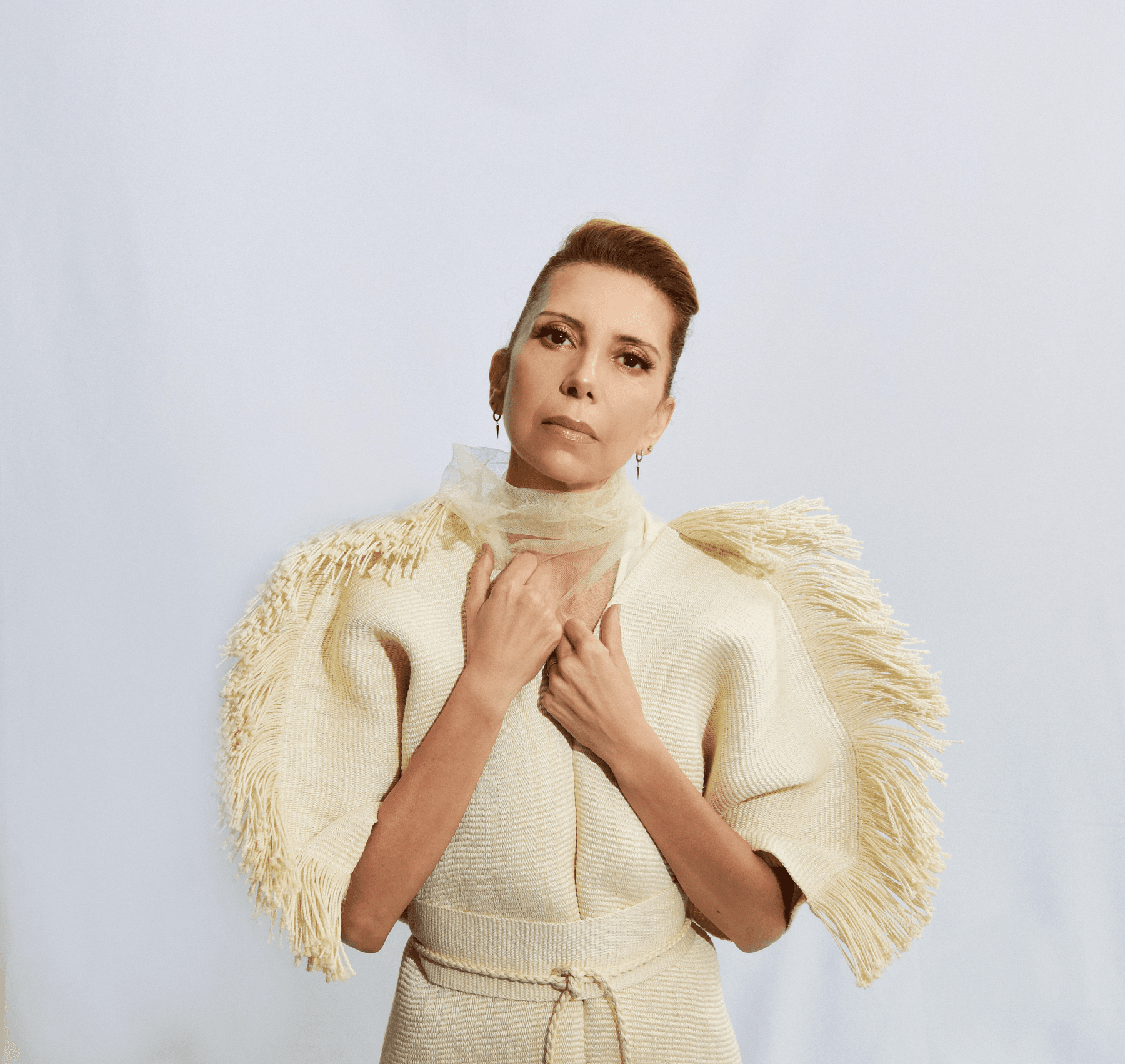 Magos Herrera in a white dress