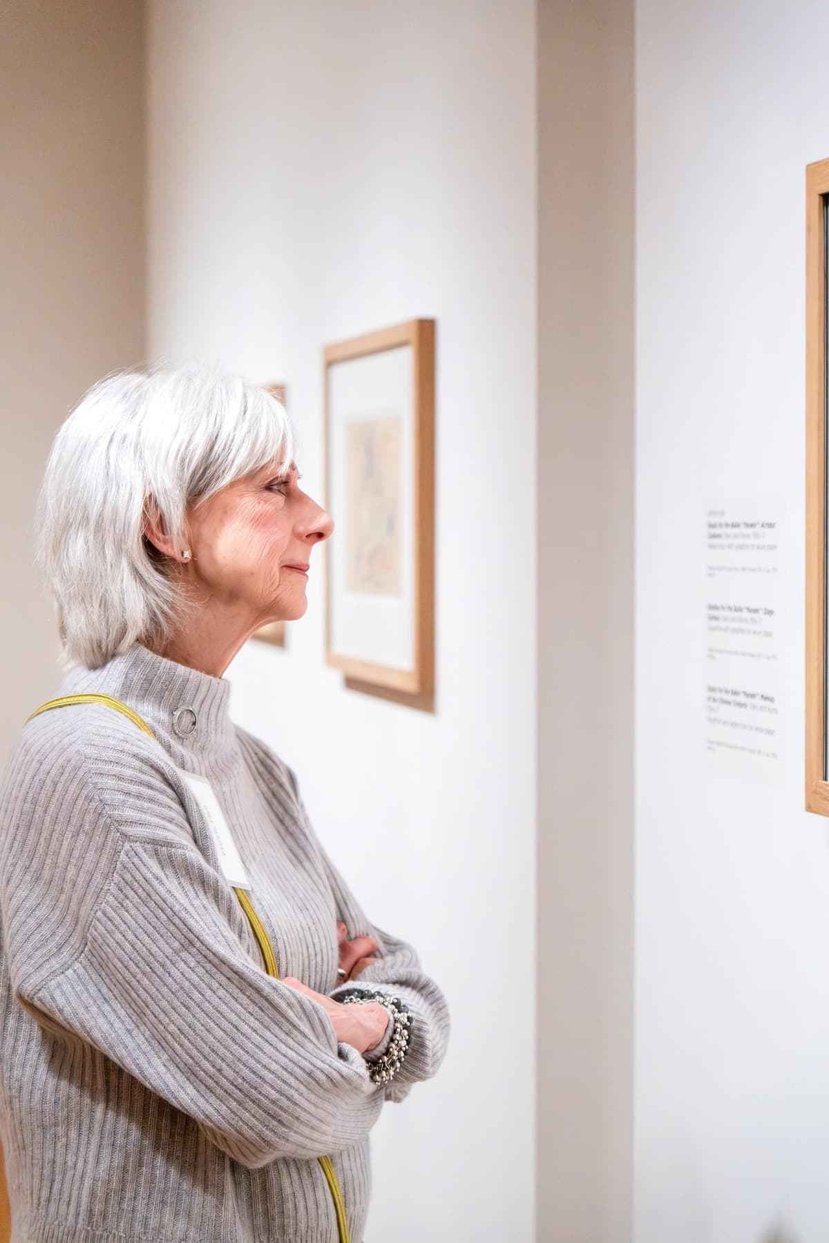 a man looking at a framed picture
