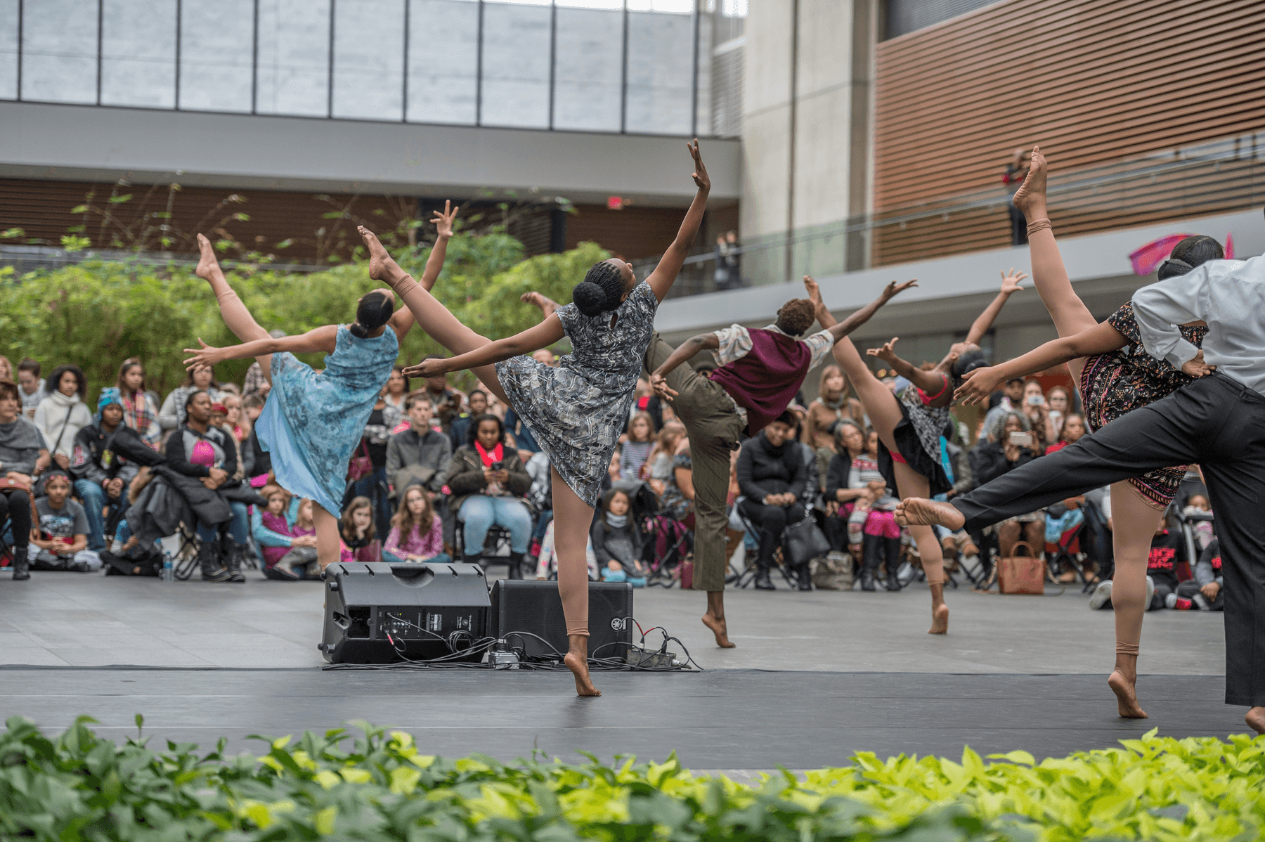 a group of people dancing on a stage