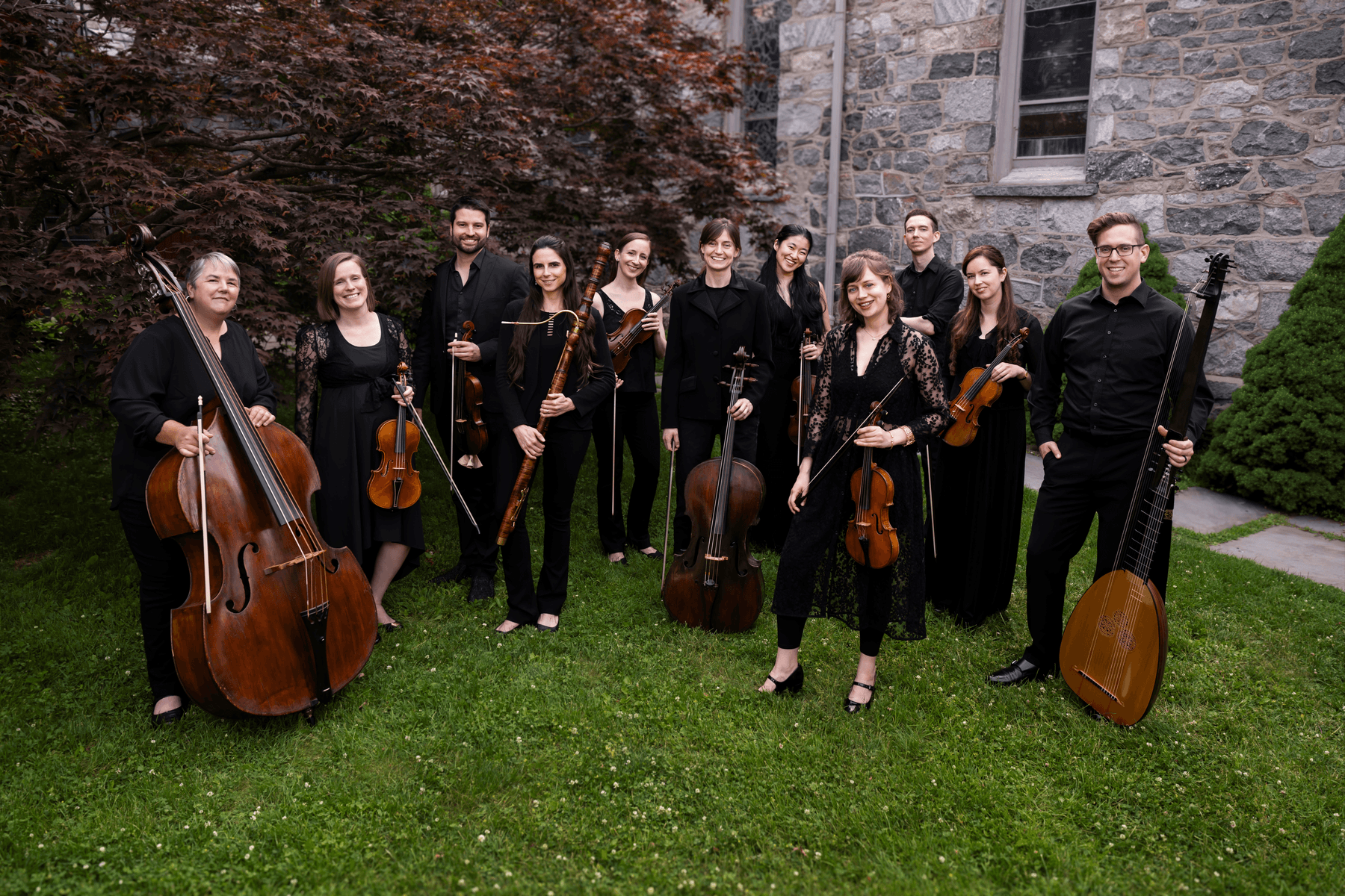 a group of people holding musical instruments