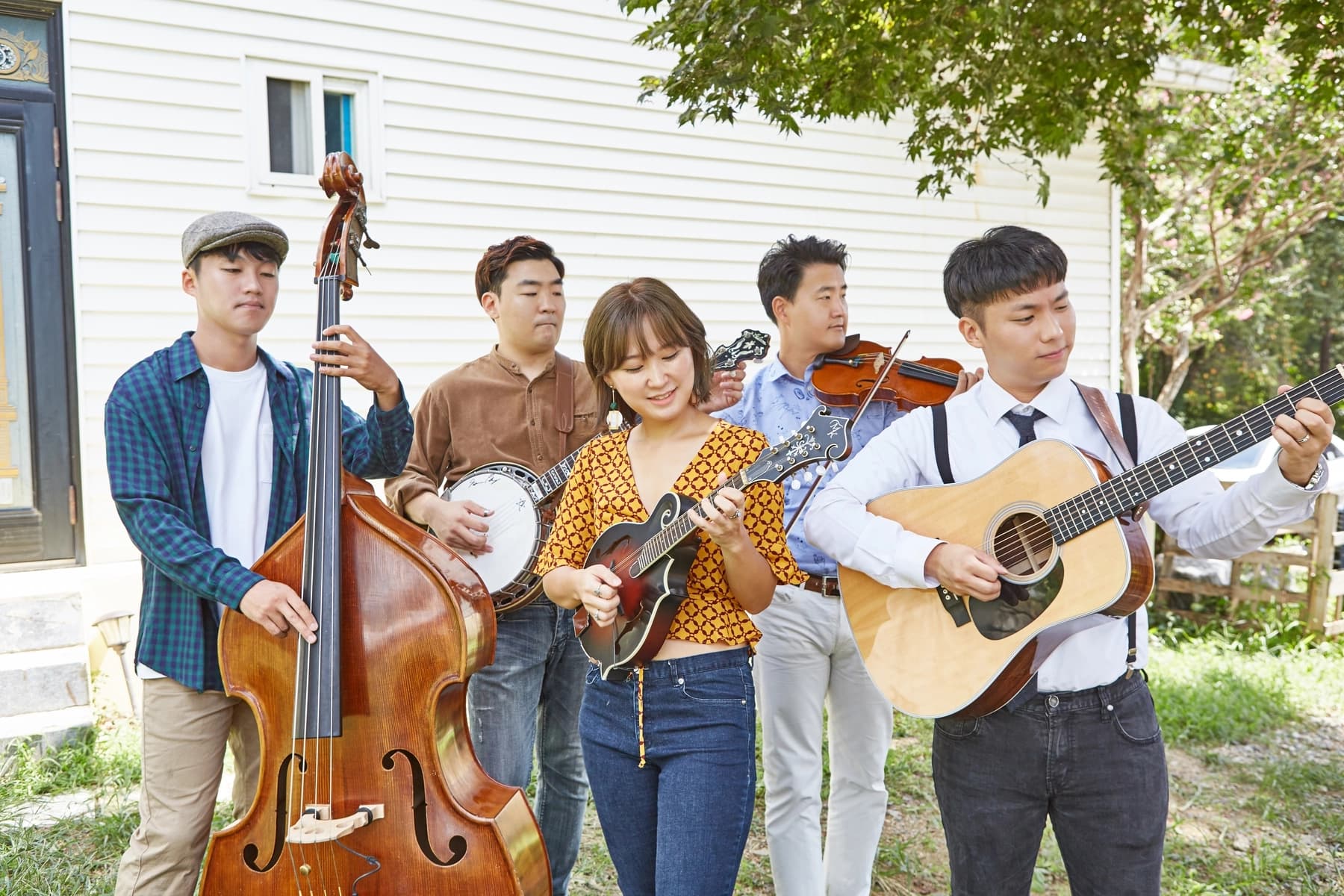 a group of people holding musical instruments
