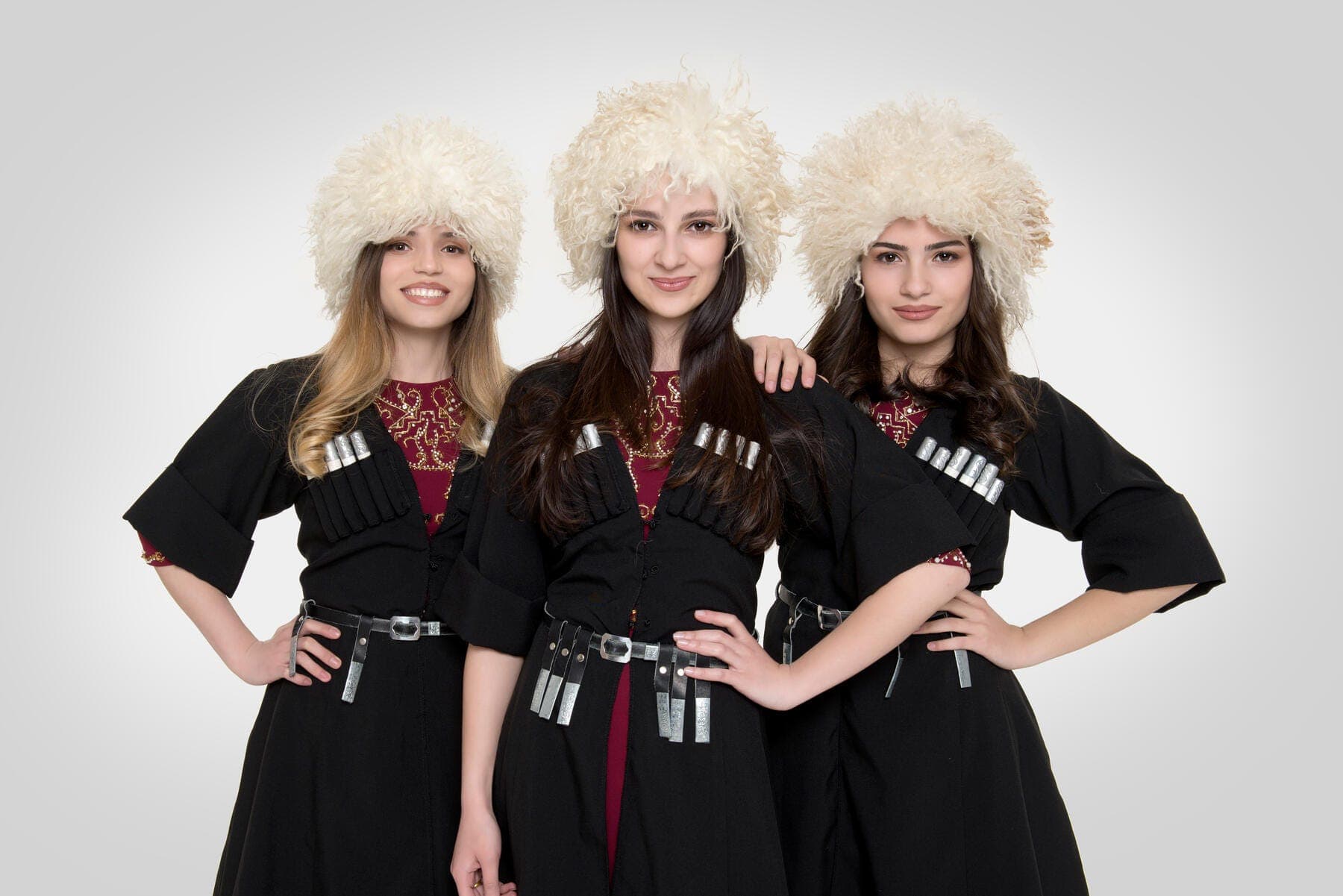 a group of women in black and white clothing