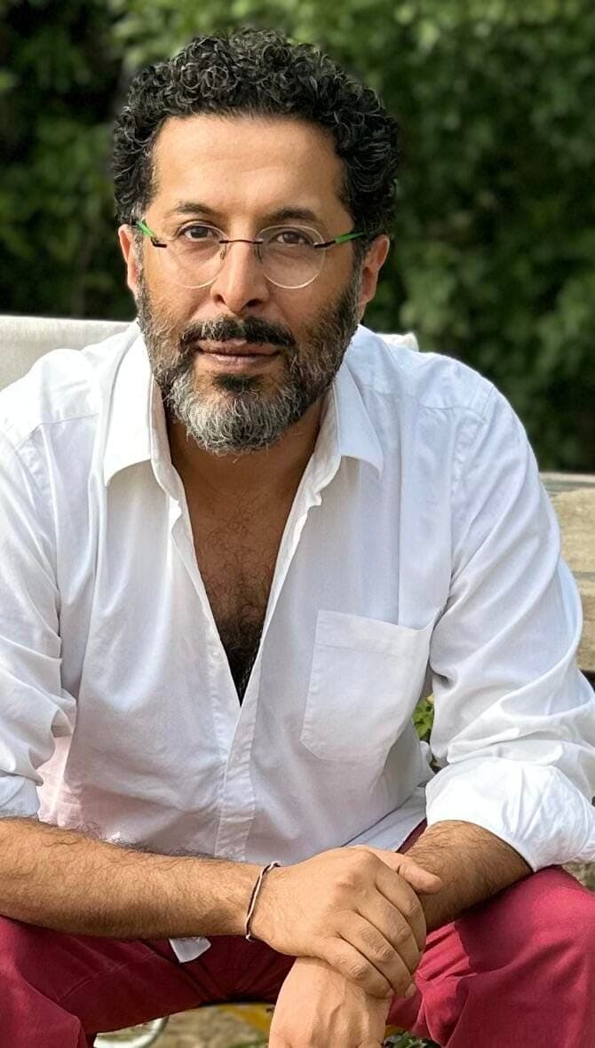 Naman Ahuja with a beard and glasses