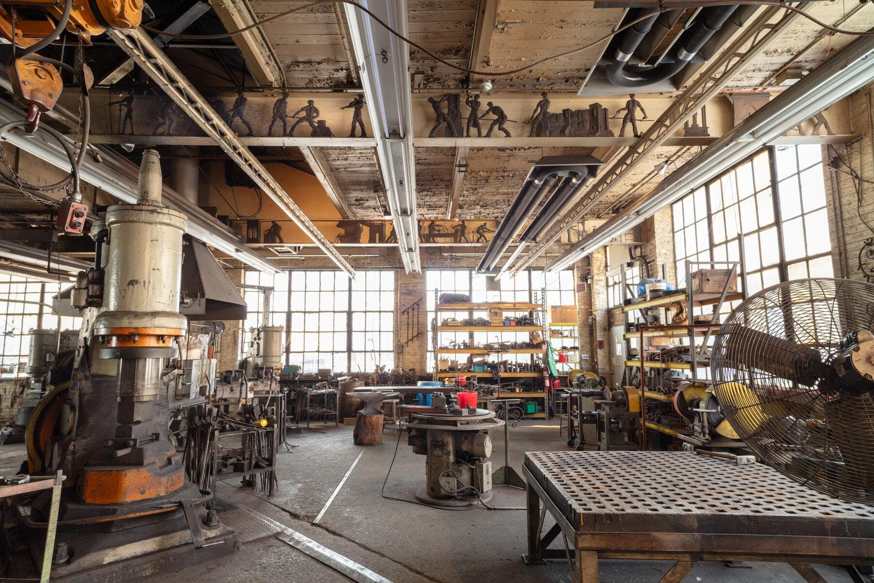 a large room with many tables and machinery