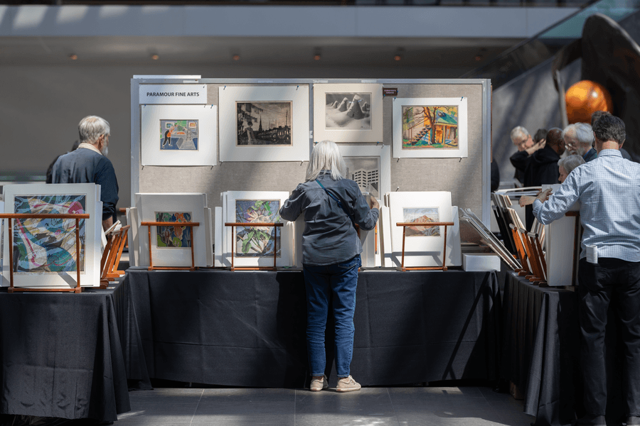 a group of people looking at art