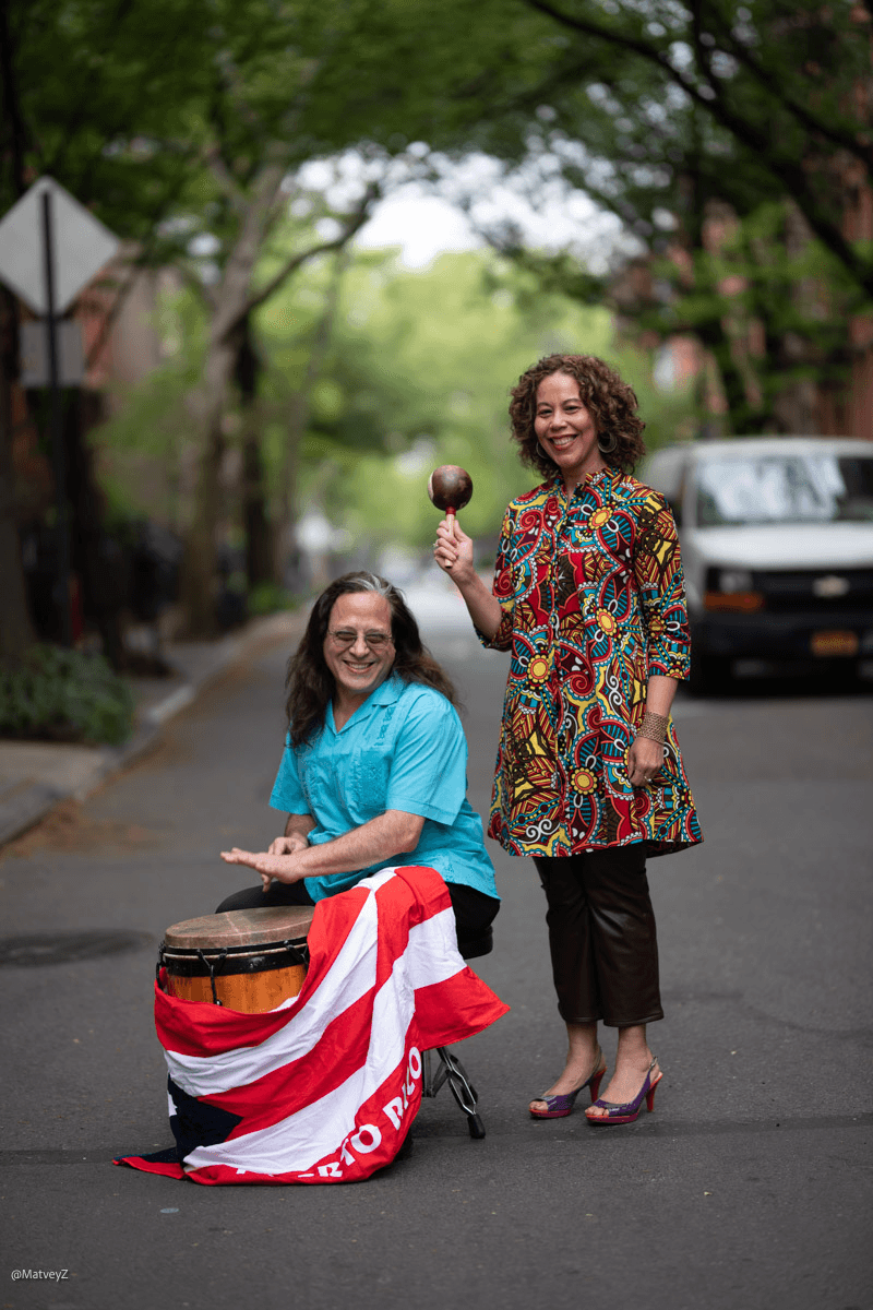 a person holding a flag and a person holding a flag