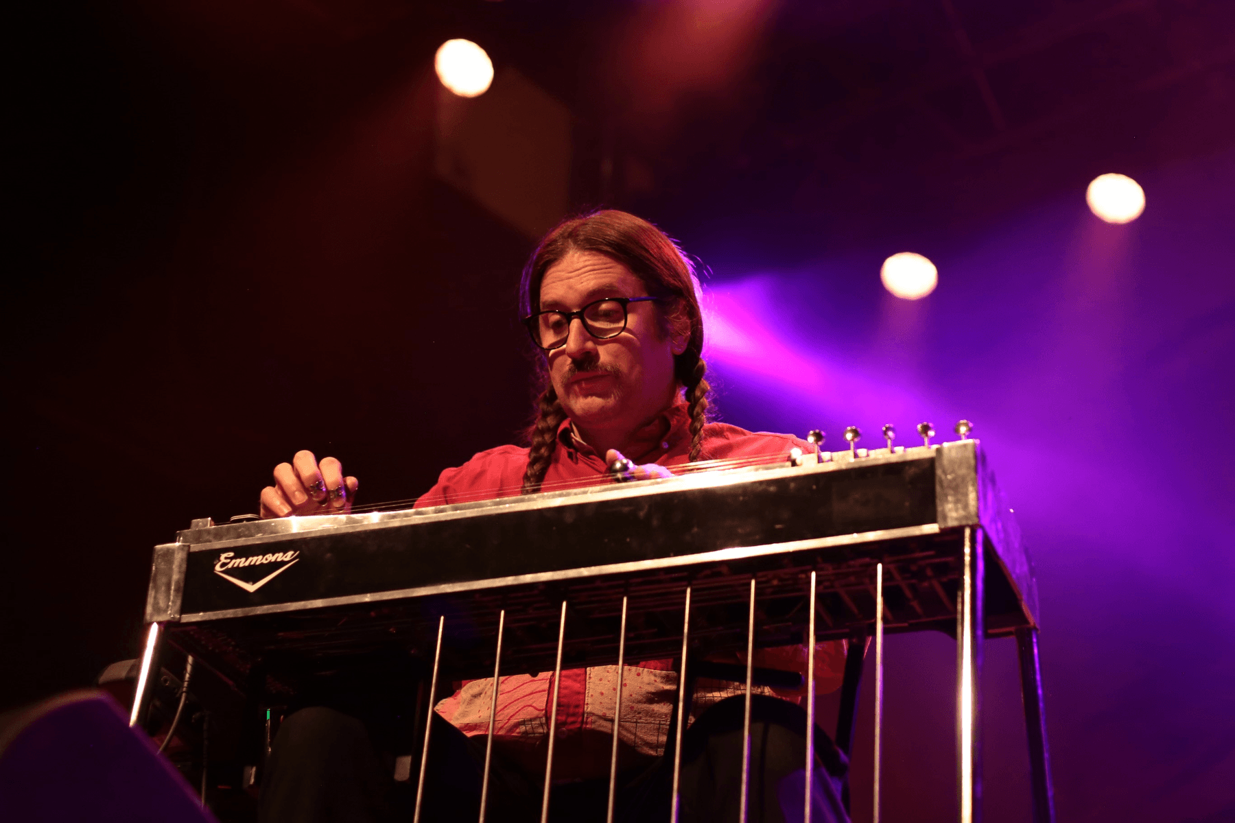 a person playing a keyboard on a stage