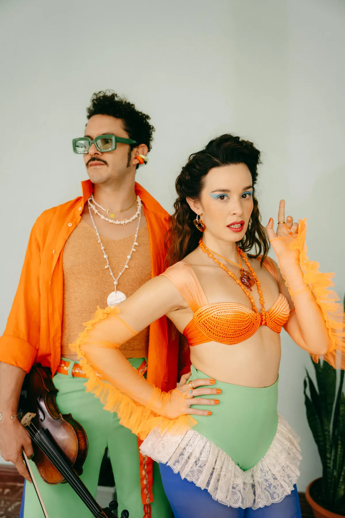 a man and woman wearing clothing