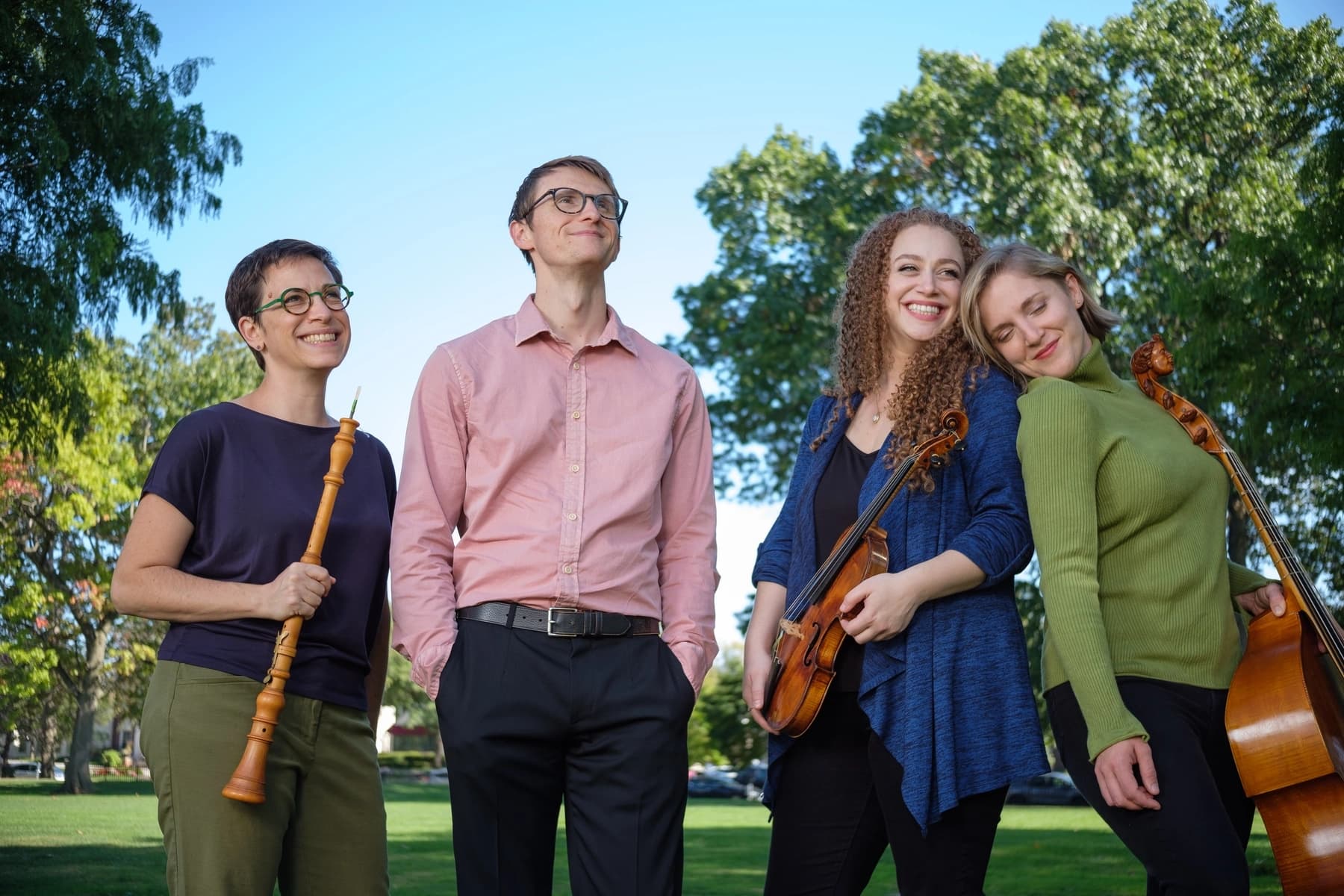 a group of people holding instruments