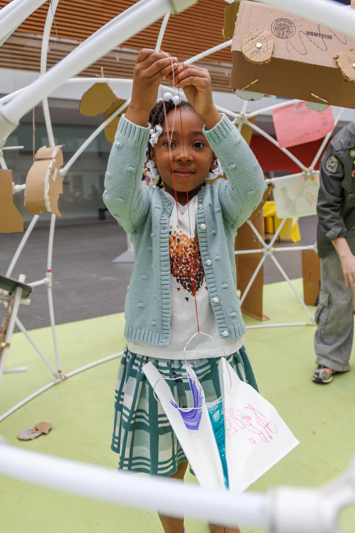 a girl holding a box