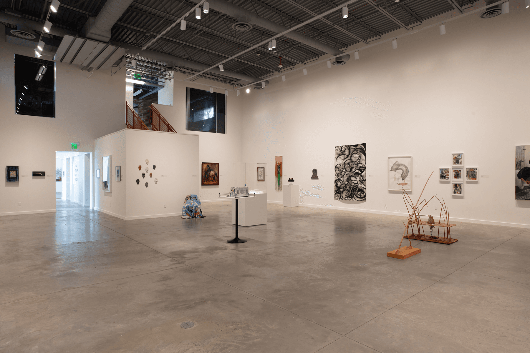 a large room with art on the walls
