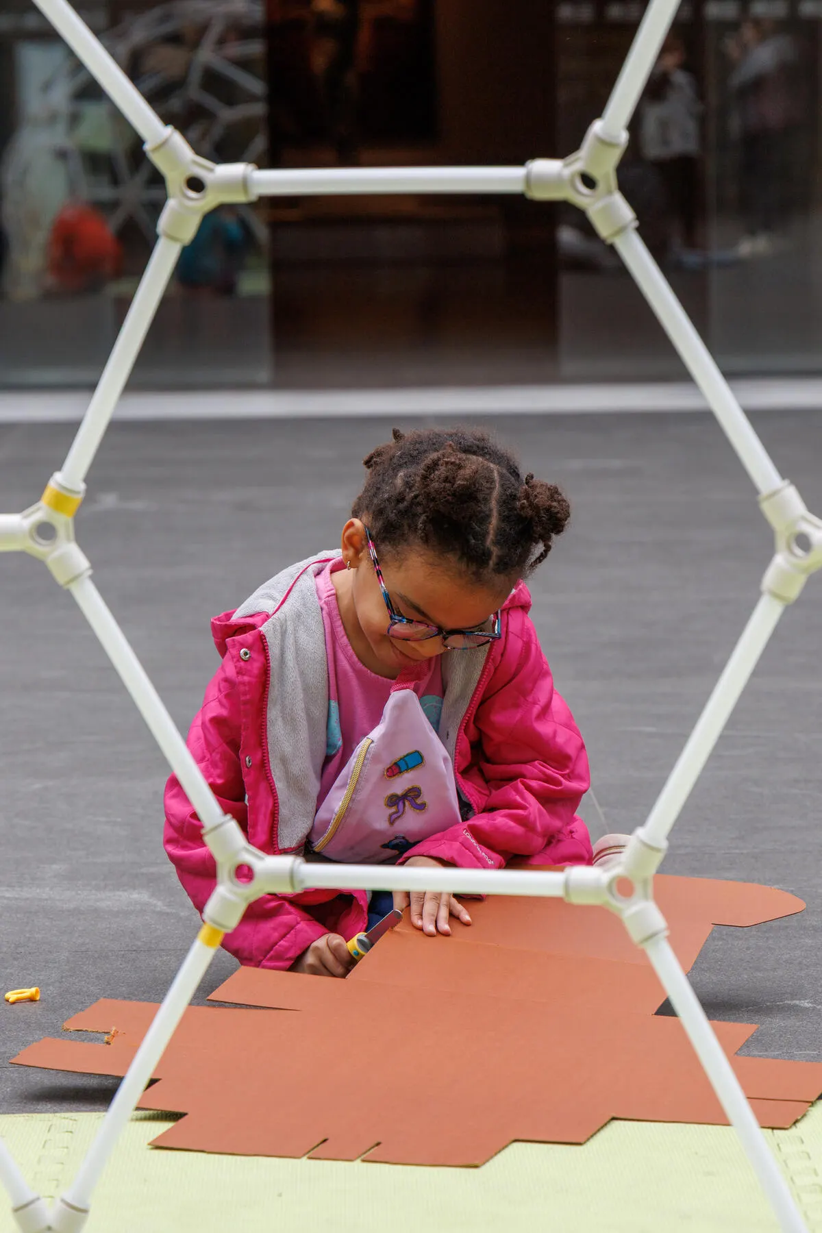a girl playing on a playground