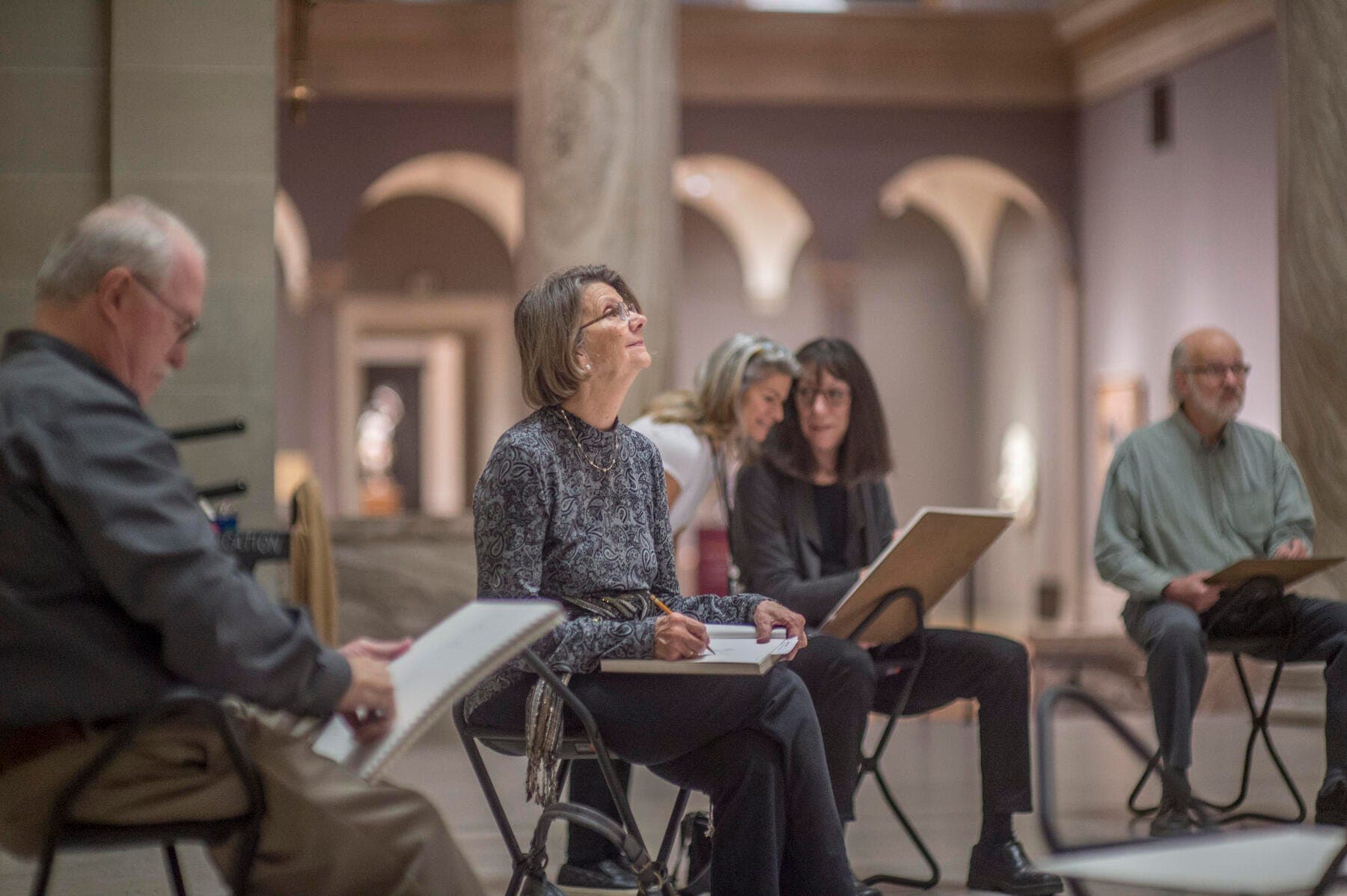 a group of people sitting in chairs