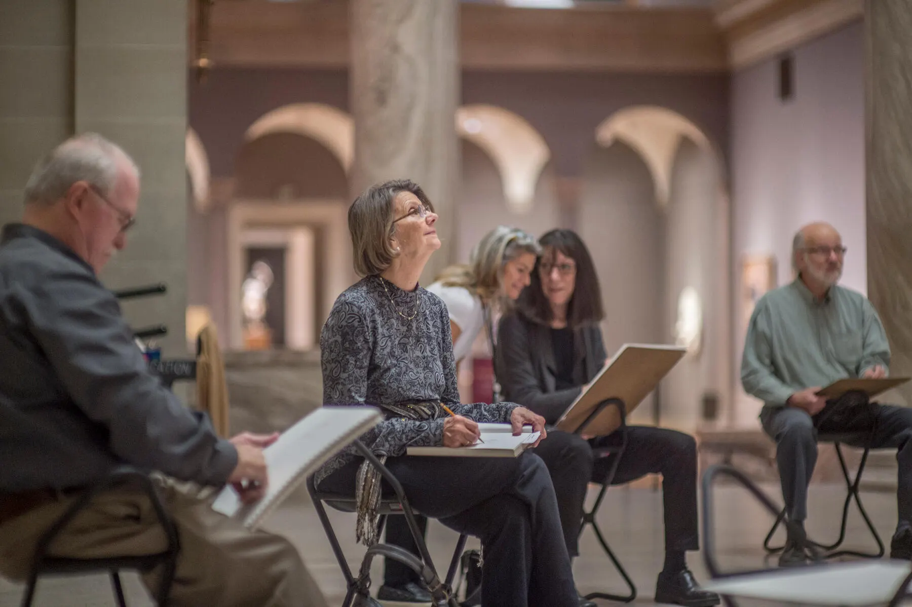 a group of people sitting in chairs
