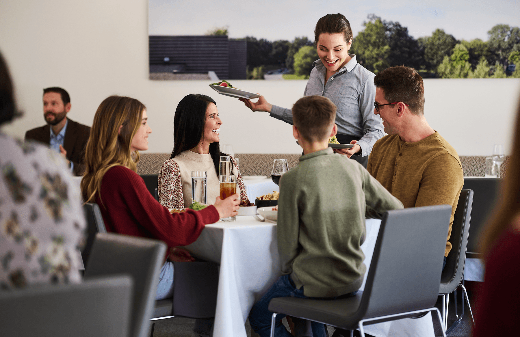a group of people sitting around a table