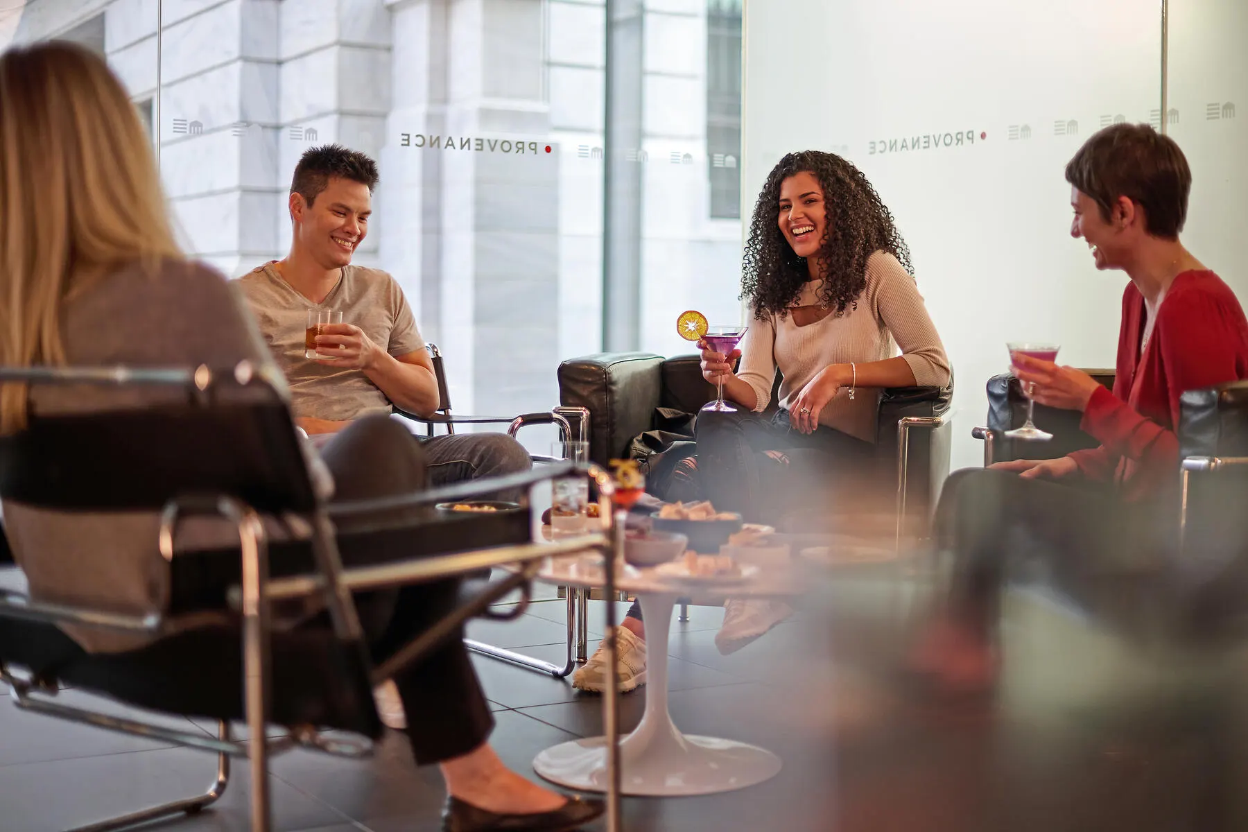 a group of people sitting around a table