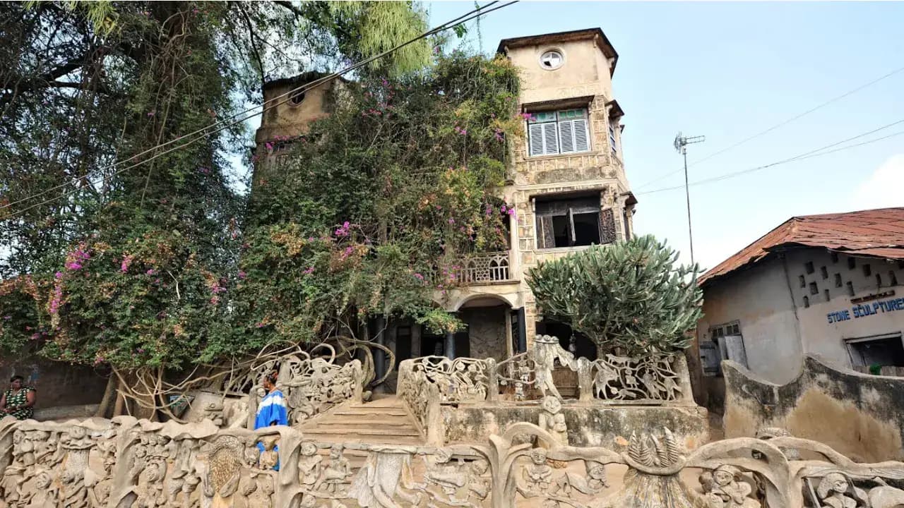 a building with a tower and trees