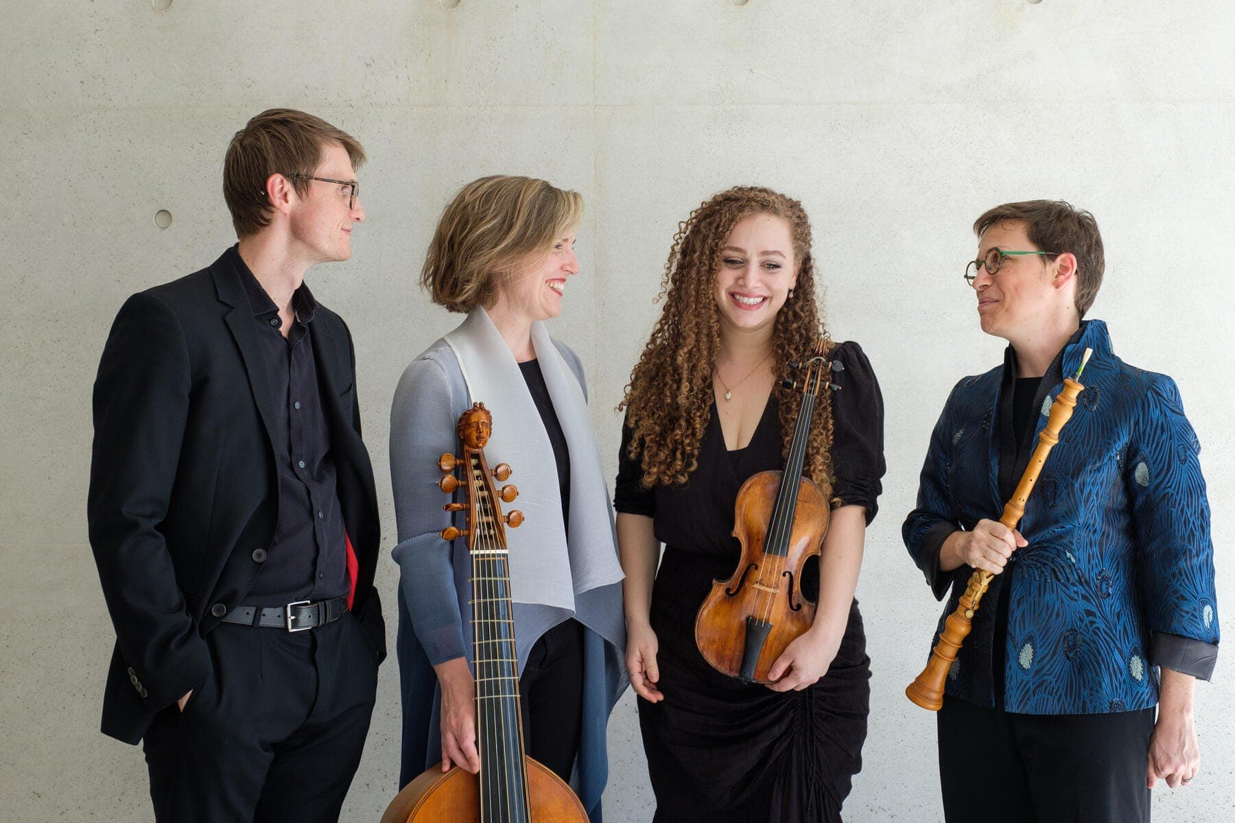 a group of people holding musical instruments