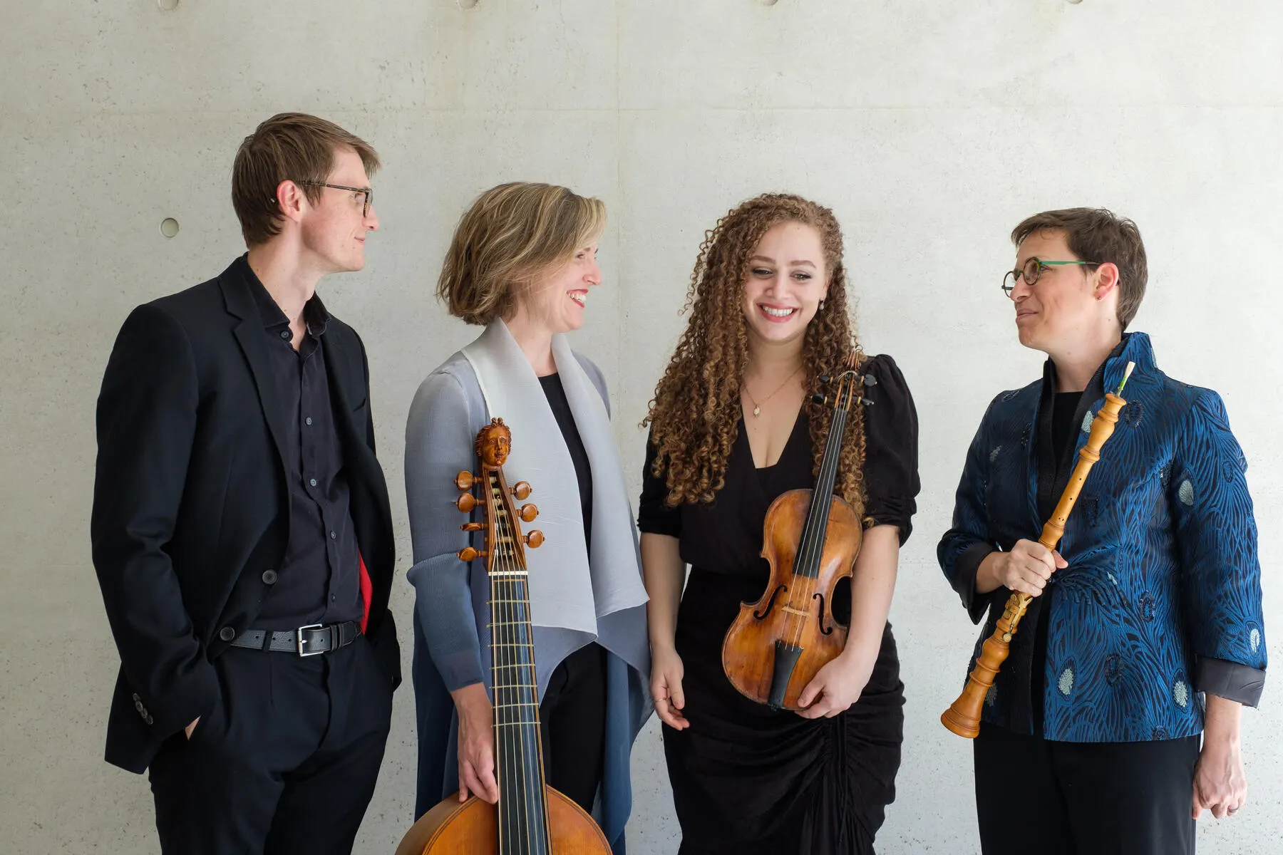 a group of people holding musical instruments