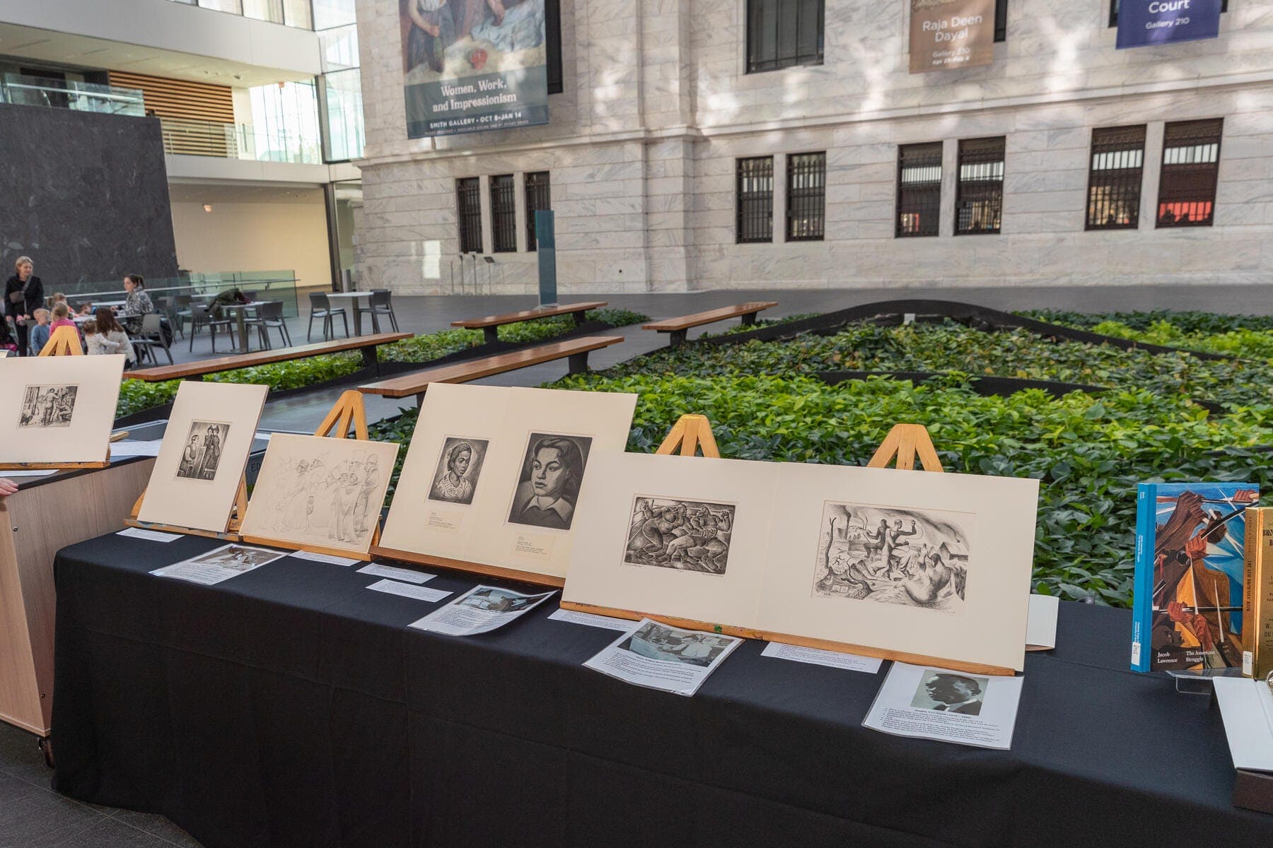 a table with several paintings on it