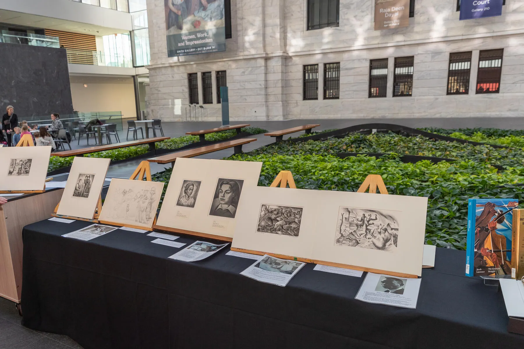 a table with several paintings on it