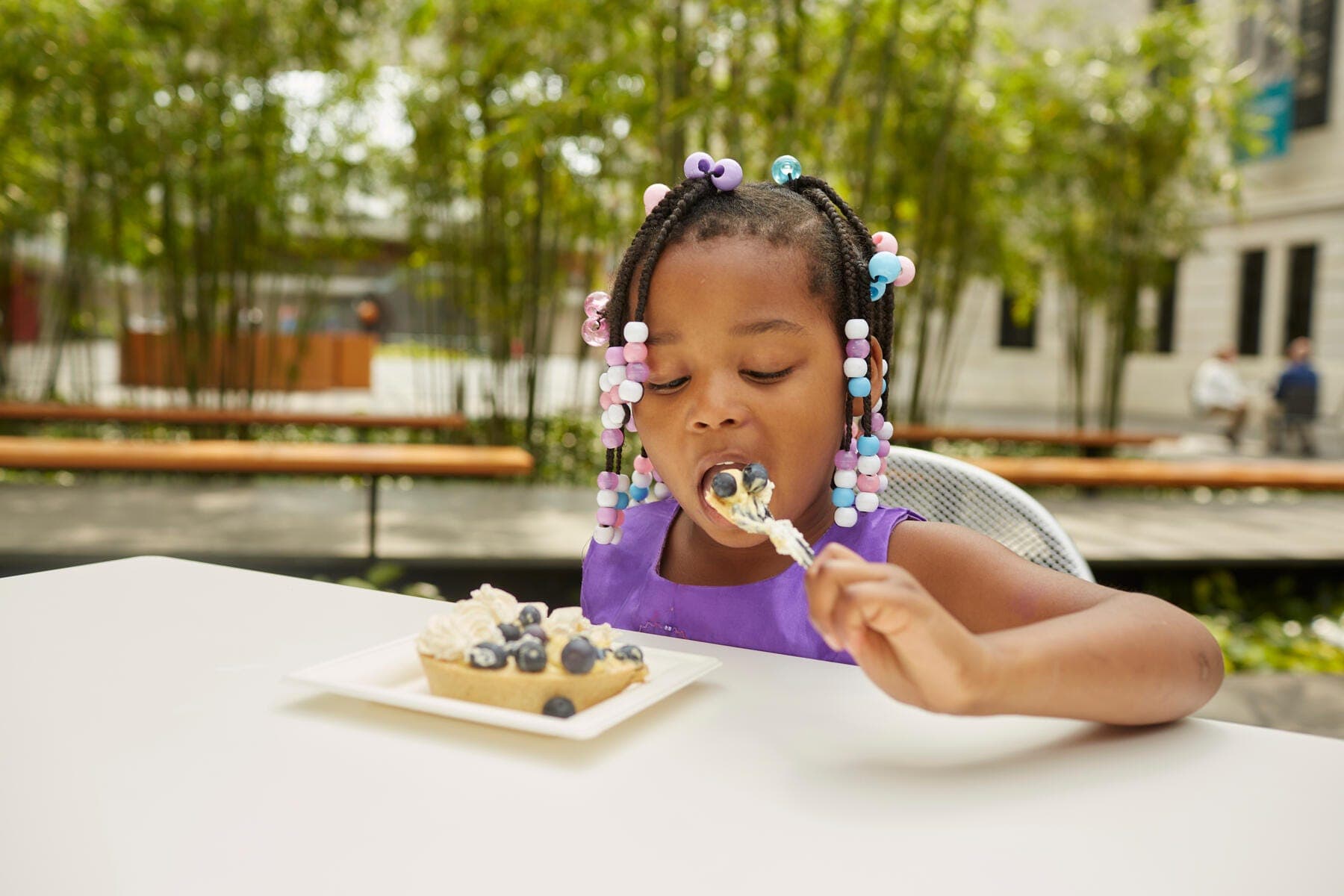 a girl eating a cake