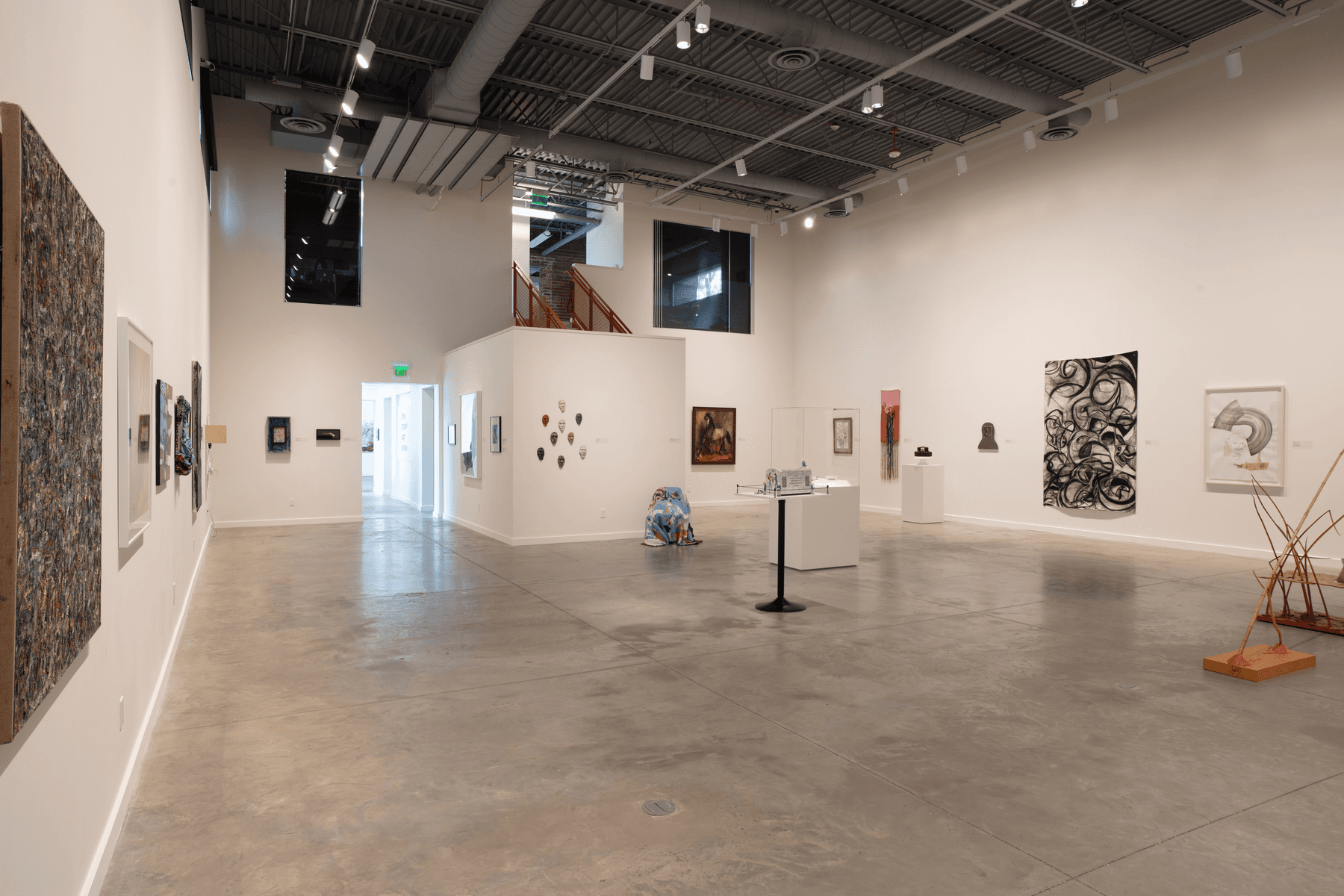 a large room with art on the walls
