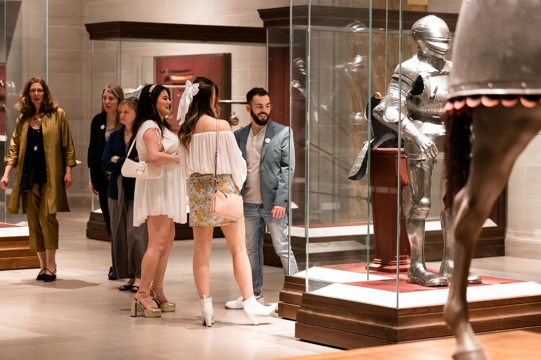 a group of people standing in front of a statue