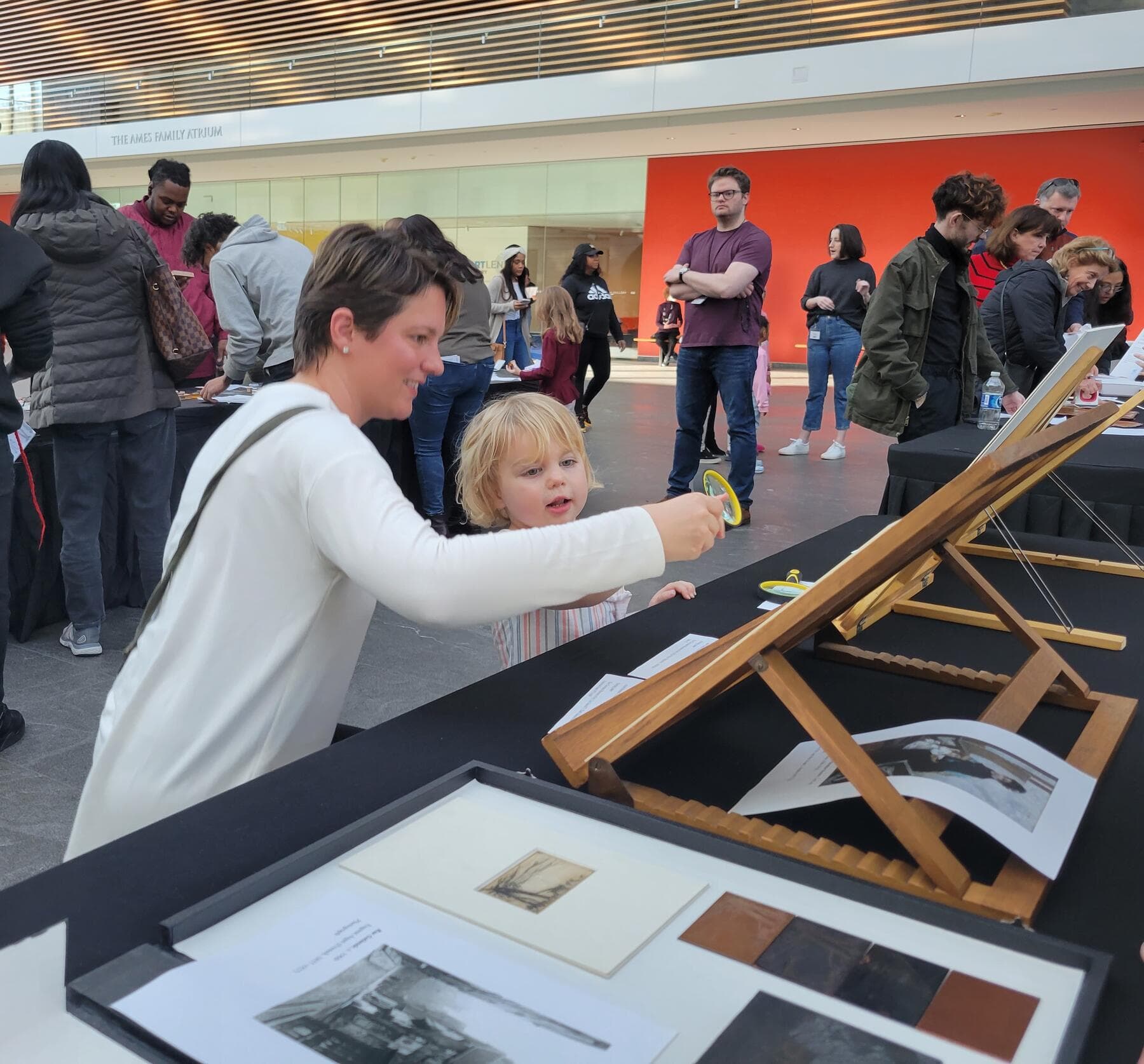 a person and a boy looking at a model of a ship