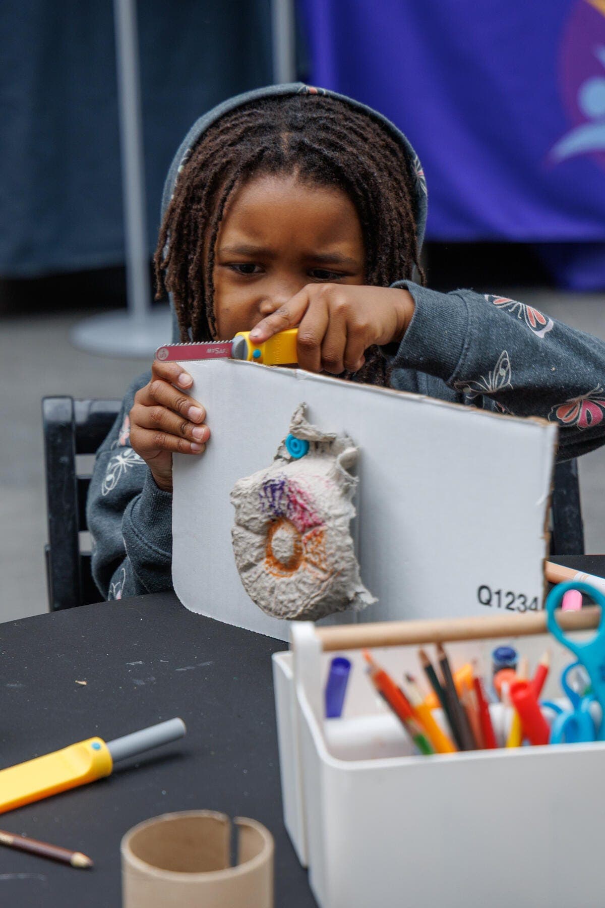 a child drawing on a paper