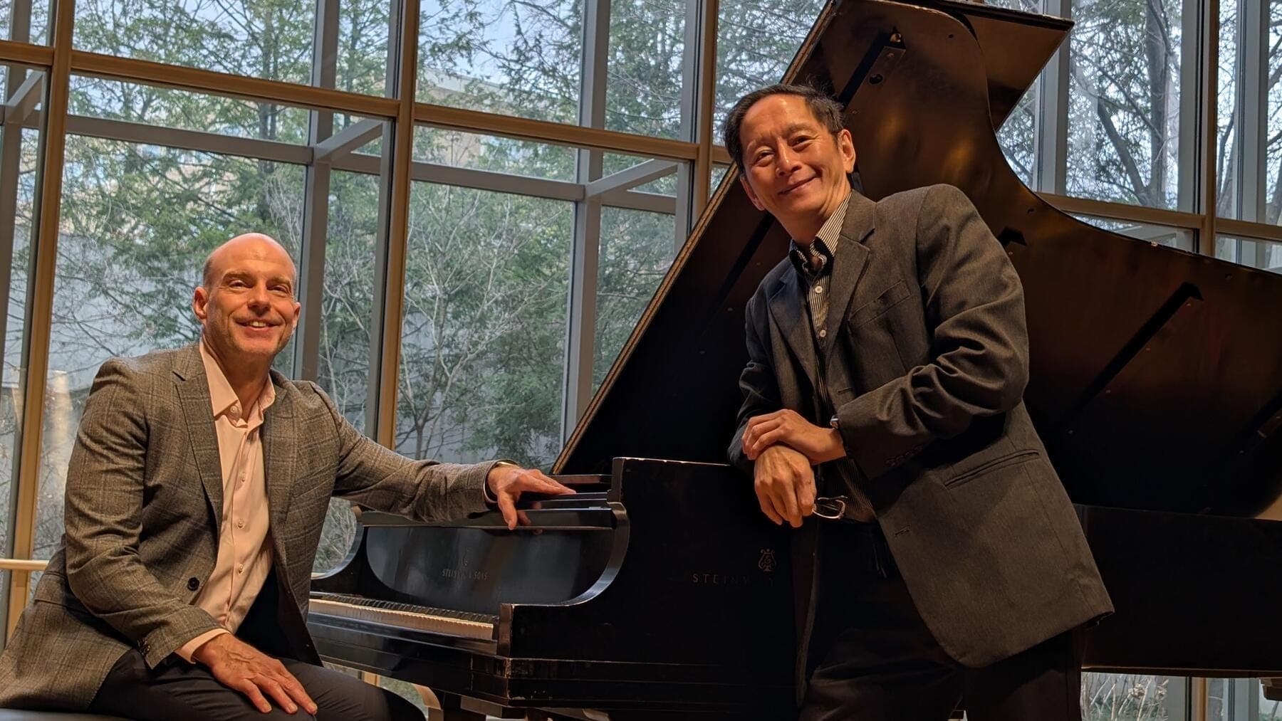 Alan Tam et al. sitting at a piano