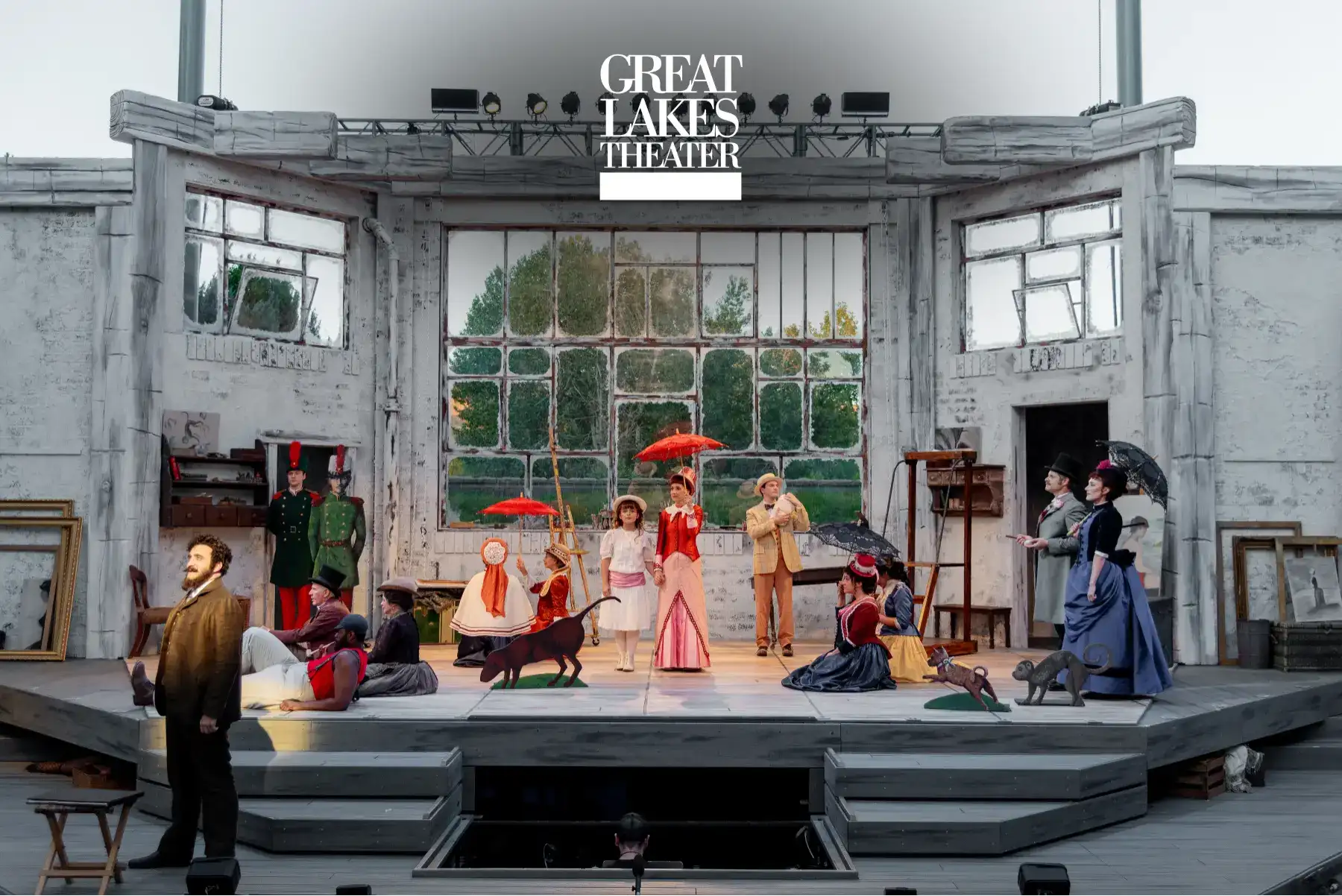 a group of people sitting at tables outside