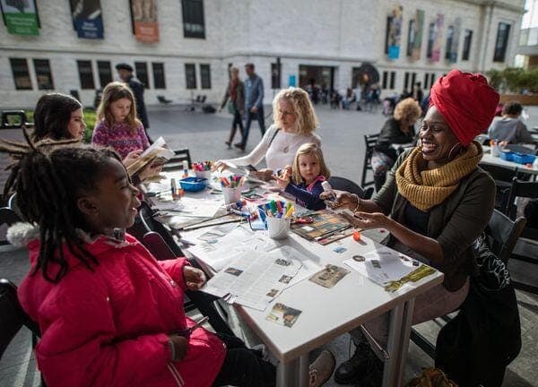 a group of people sitting at a table