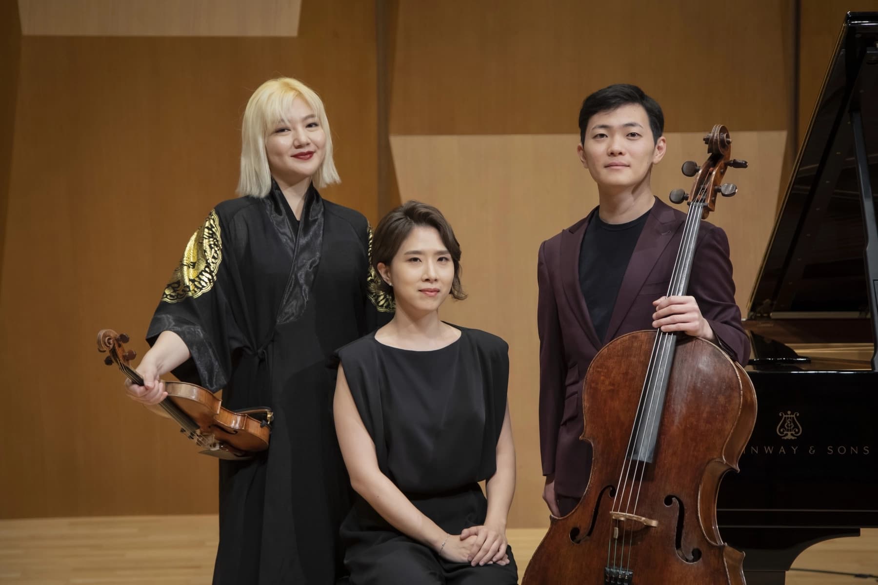 a group of people holding musical instruments