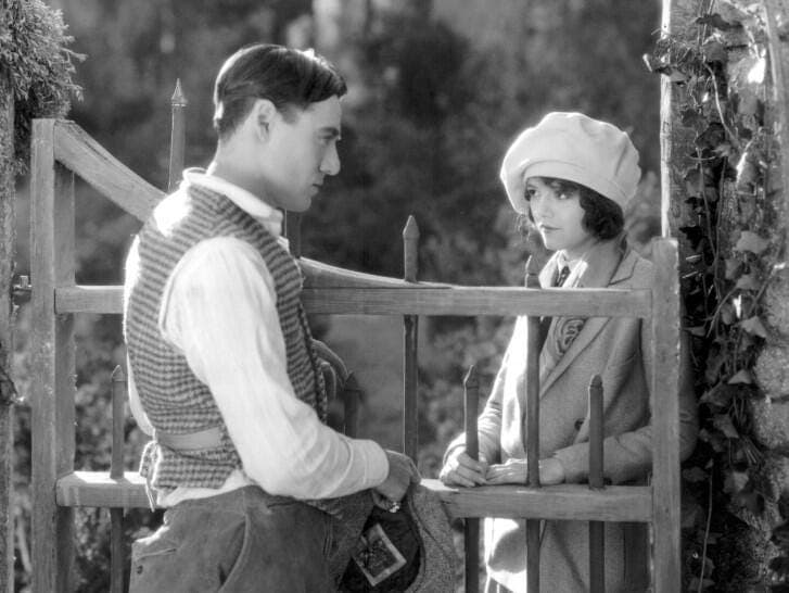 a man and woman looking at each other