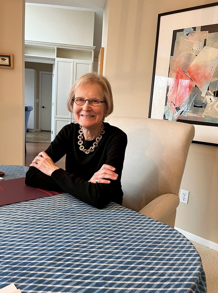 Woman sitting down at table