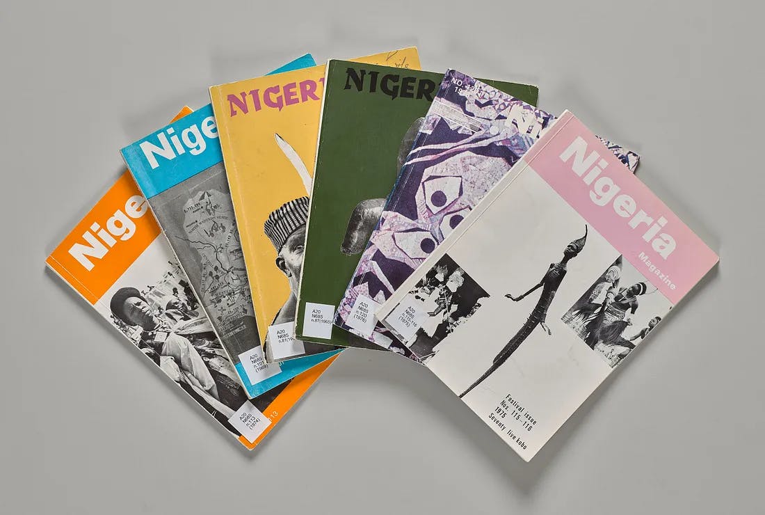 colorful magazines laid across a grey background featuring the title "Nigeria" on all of the magazines. 