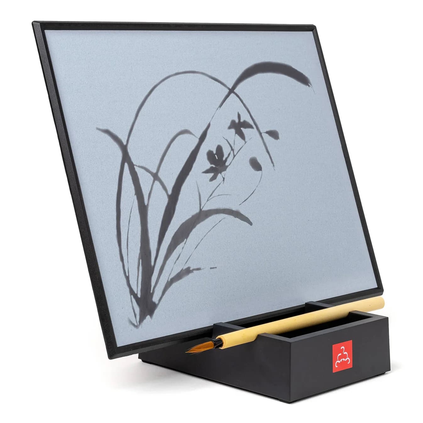 A buddha board with a a drawing of a flower.