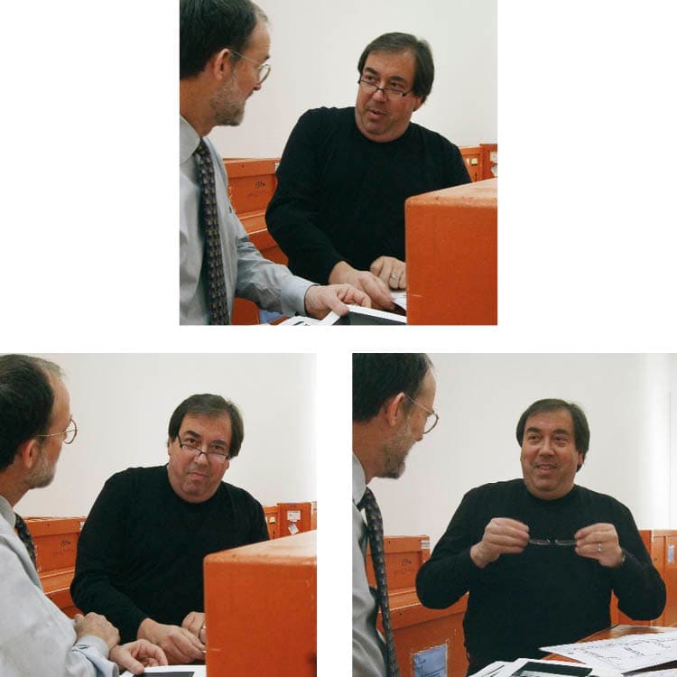 Mark Schwartz and Curator of Photography Tom Hinson confer in the new east wing galleries amid temporarily stored shipping crates.