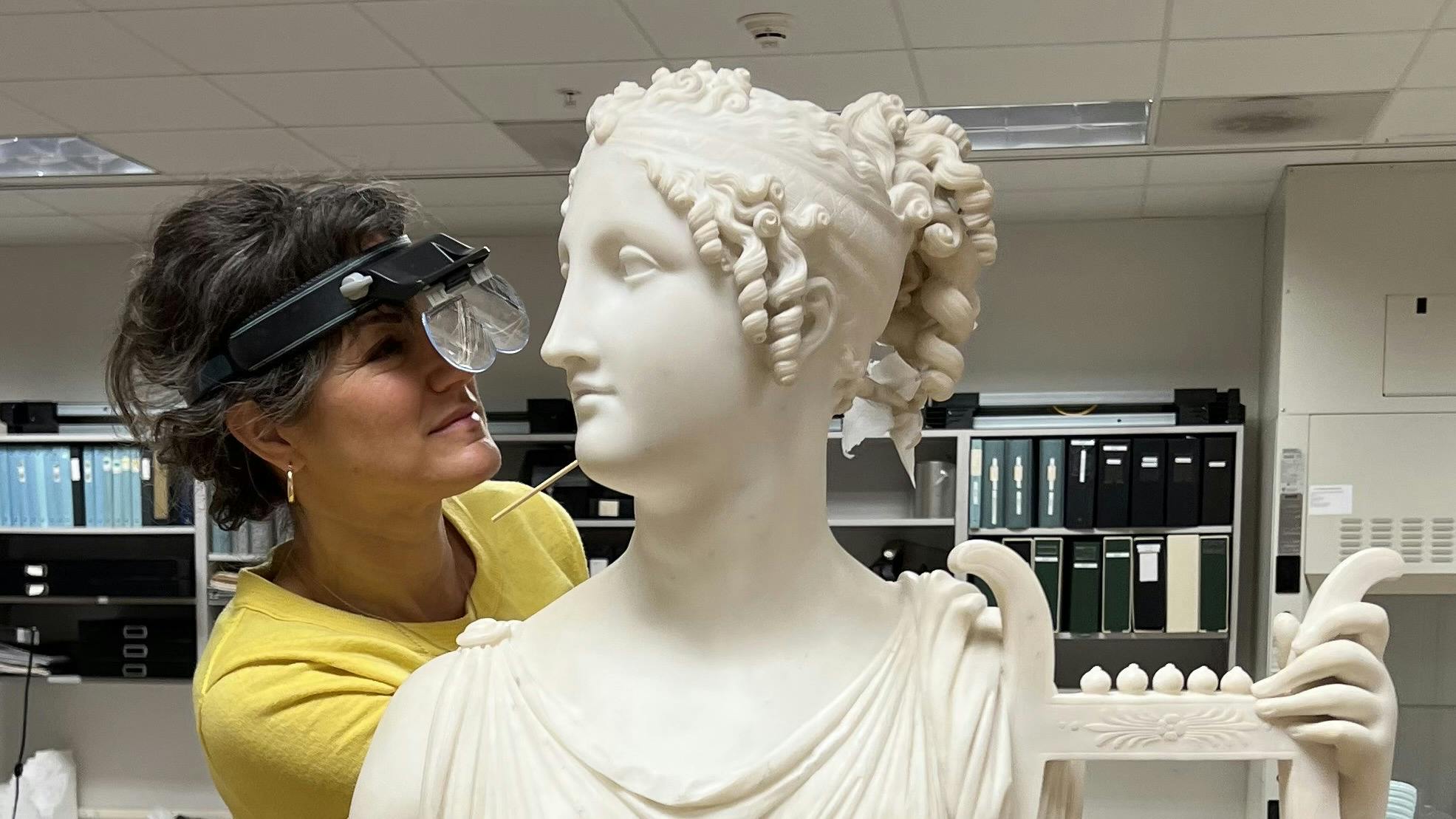 Head of Objects Conservation, Beth Edelstein, treating Terpsichore Lyran (Muse of Lyric Poetry).