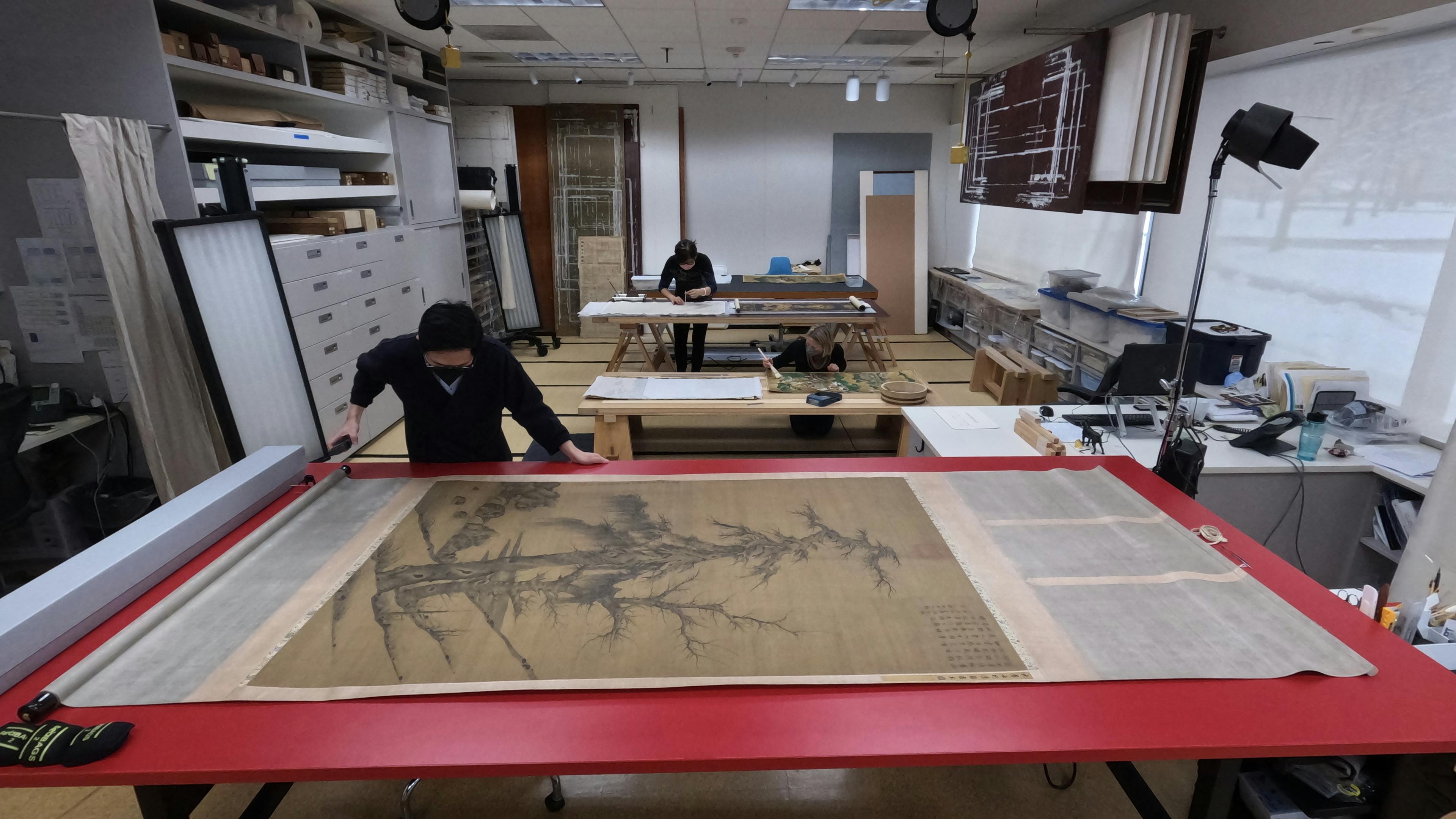 Asian Paintings Conservators at work in the Asian Paintings Conservation Lab.