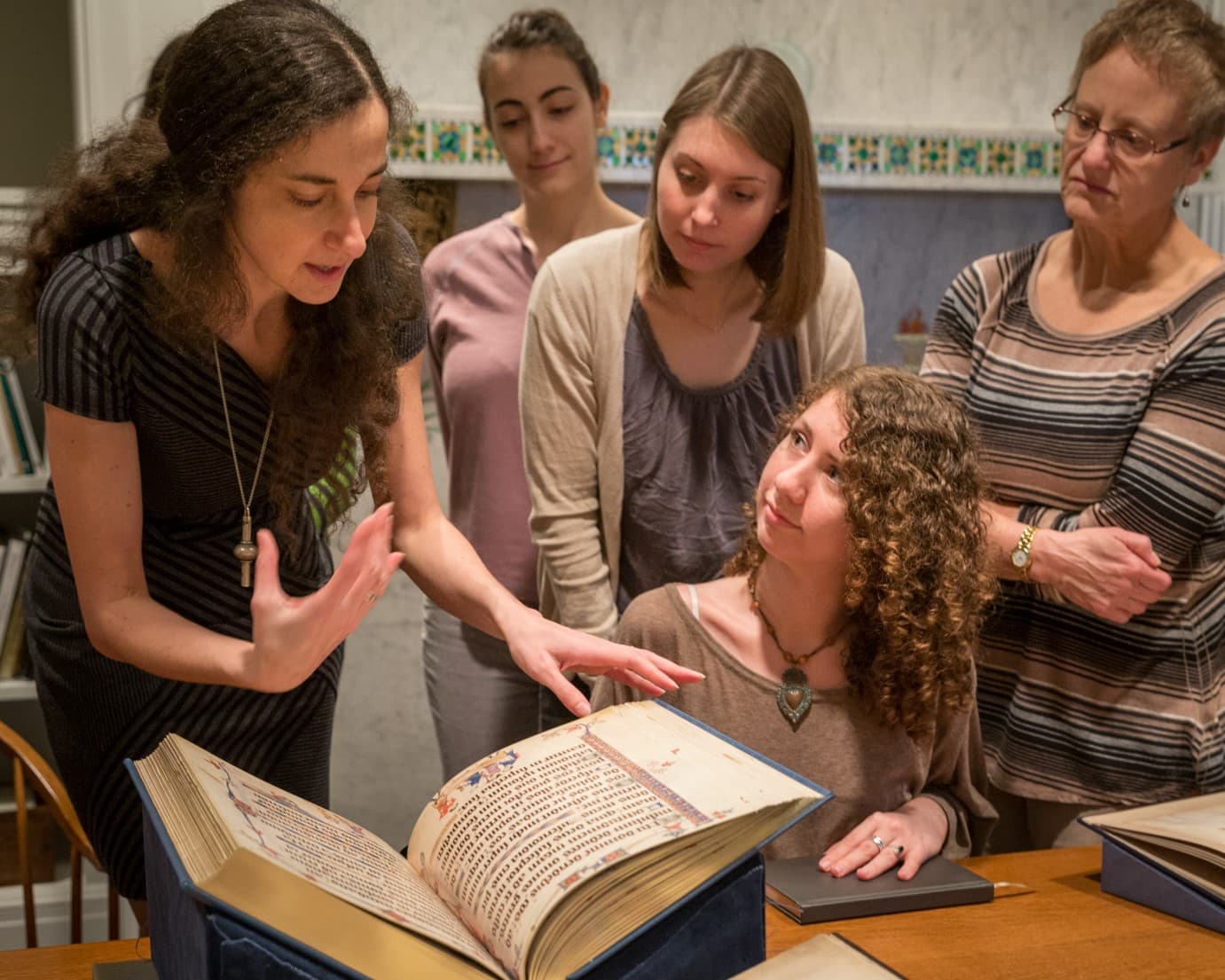 Patrons viewing rare material in the Museum Archives