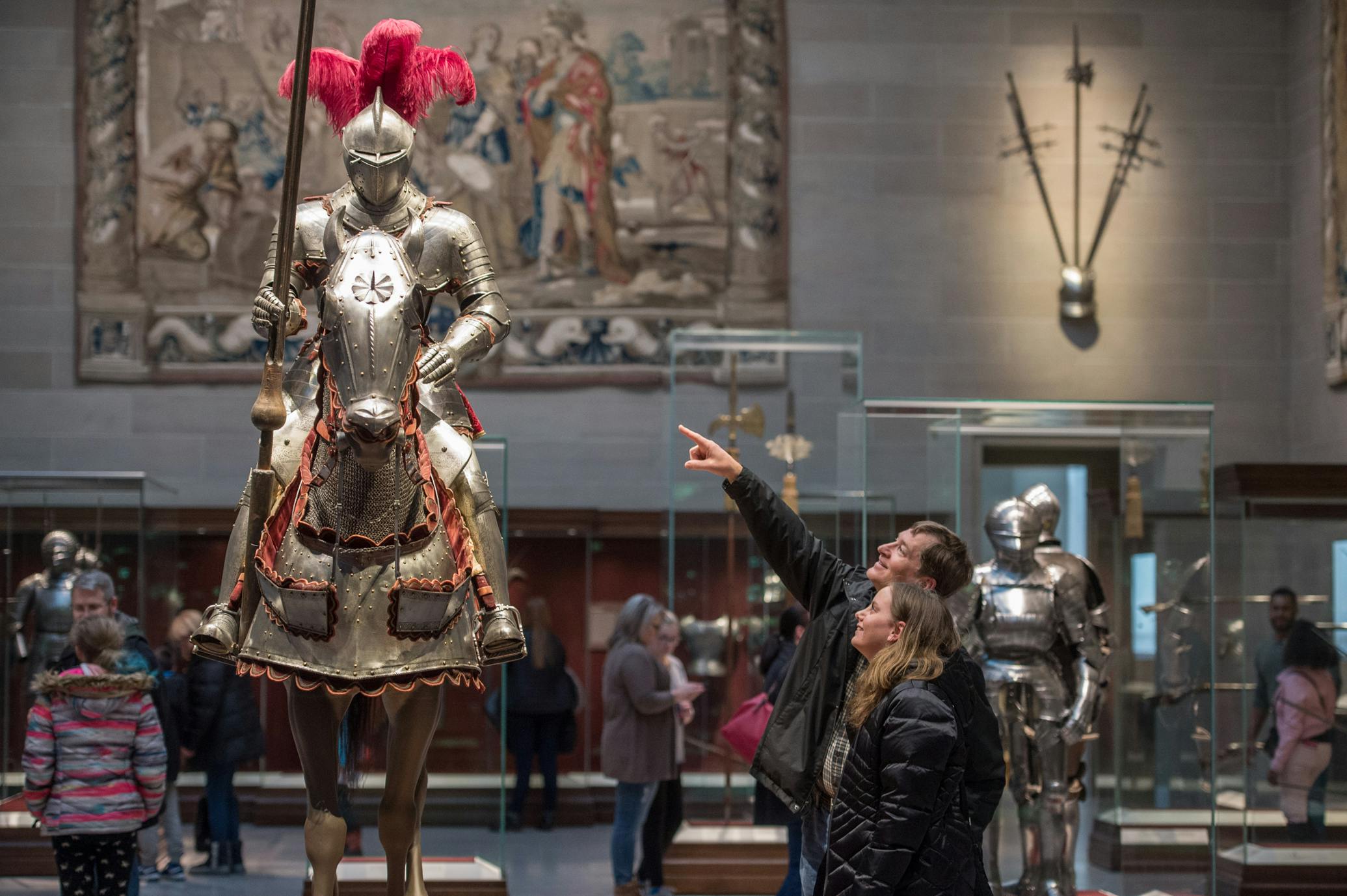 Visitors in the museum armor court