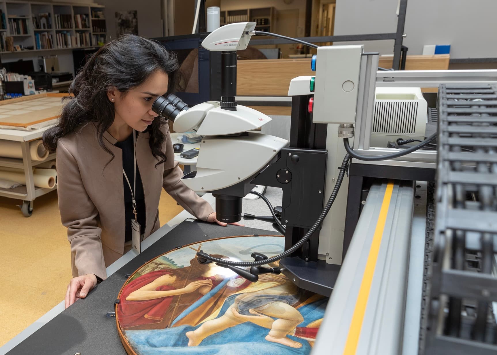 Looking at a painting under the microscope in the CMA paintings lab.