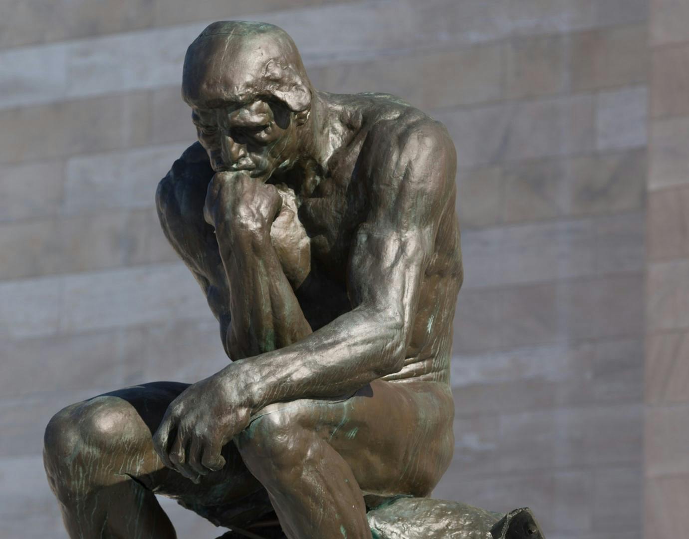 Bronze sculpture by Rodin titled "The Thinker"